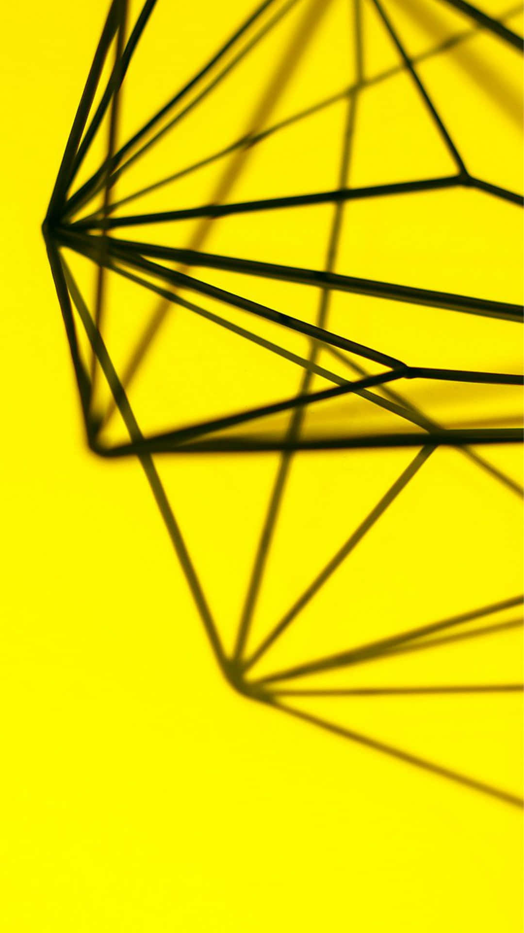 A Black And Yellow Geometric Shape On A Yellow Background