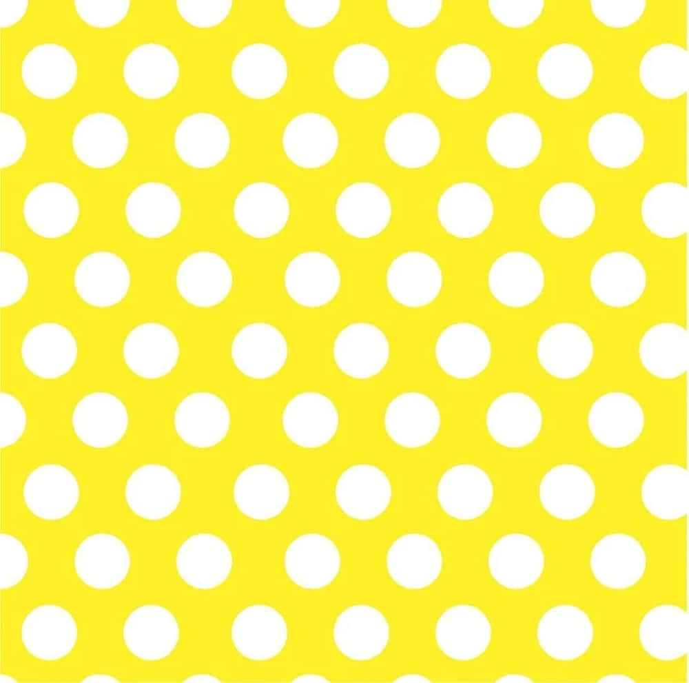 Vibrant yellow polka dot pattern Wallpaper