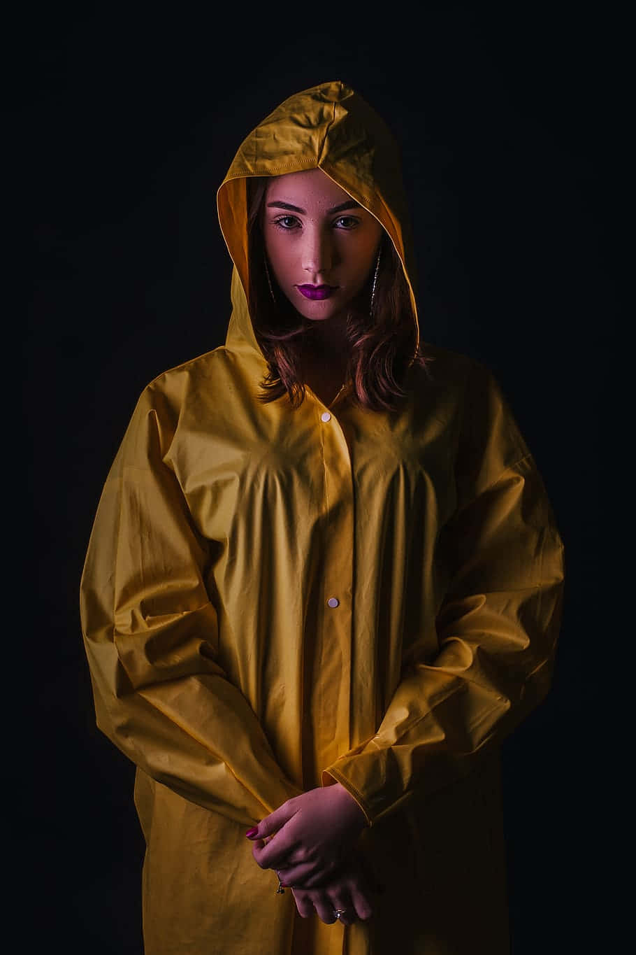 Stylish person wearing a vibrant yellow raincoat Wallpaper