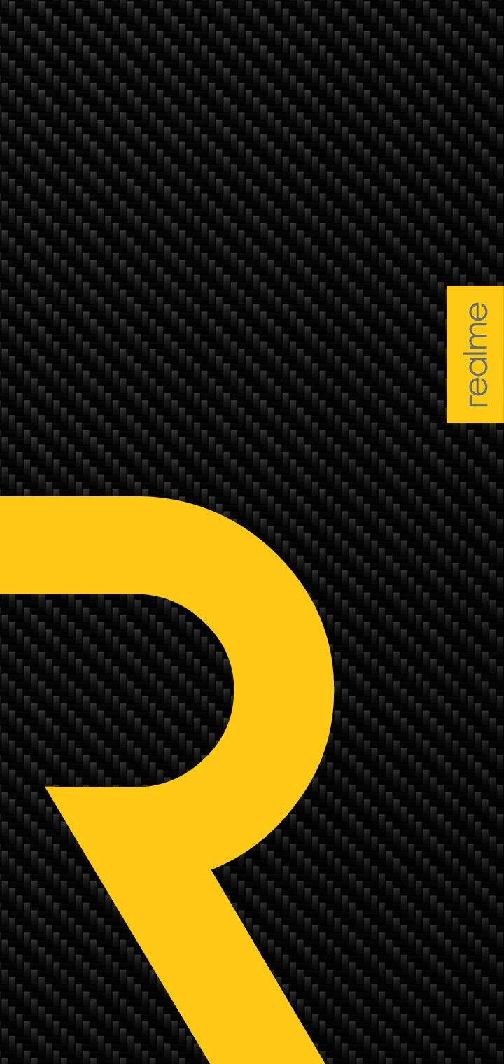 Logotipoamarillo De Realme En Fibra De Carbono Fondo de pantalla