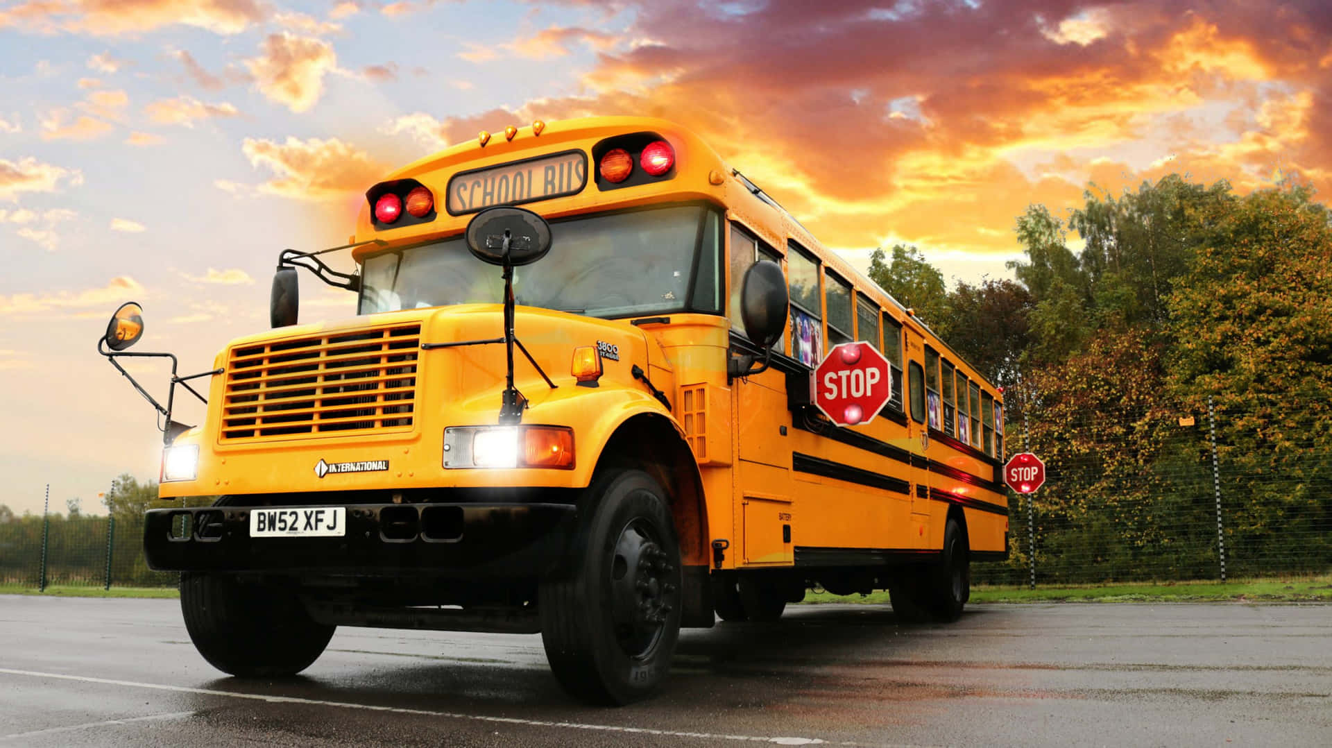 Classic Yellow School Bus on a Sunny Day Wallpaper