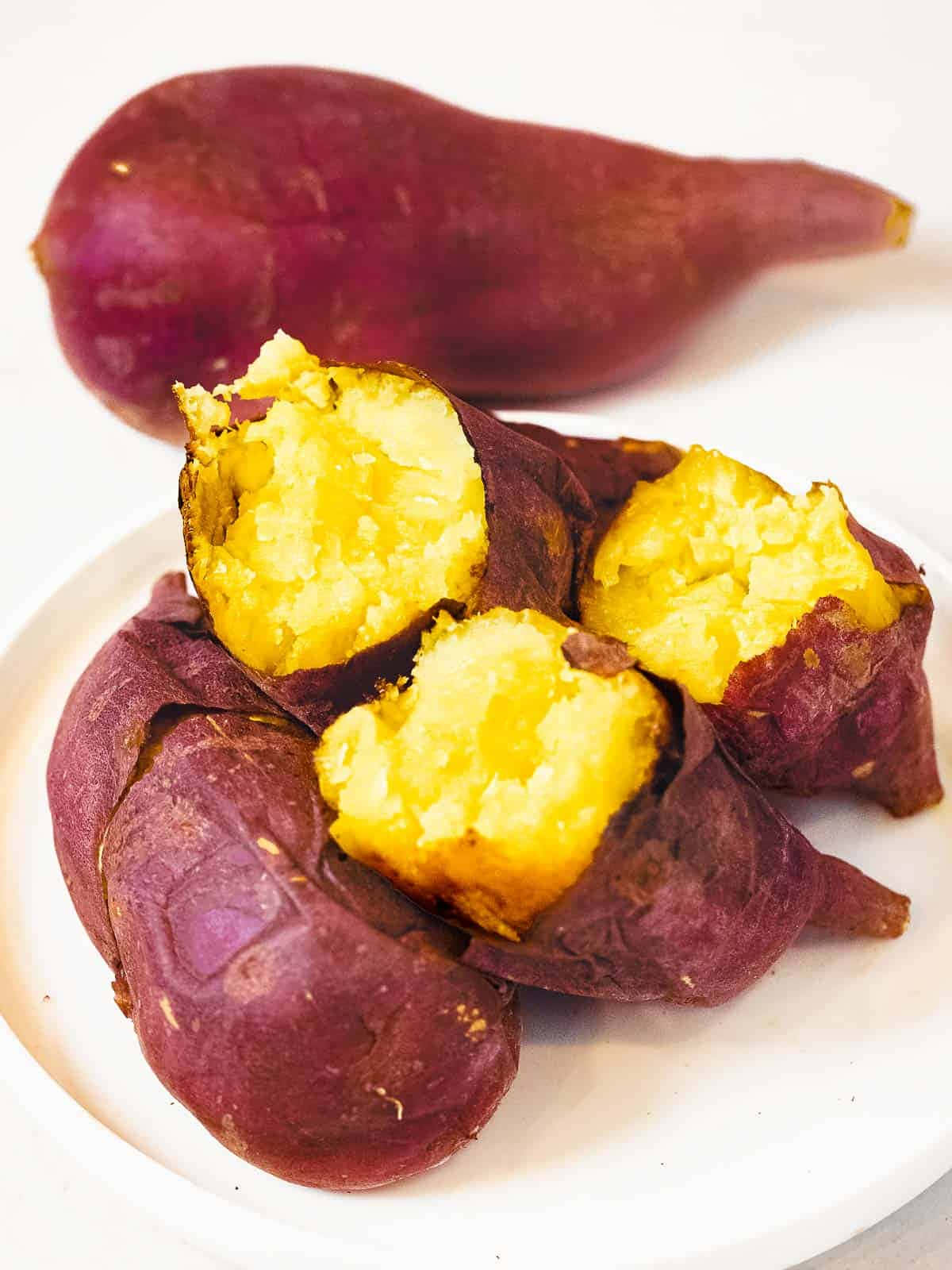 Fresh Yellow Sweet Potato on Rustic Table Wallpaper