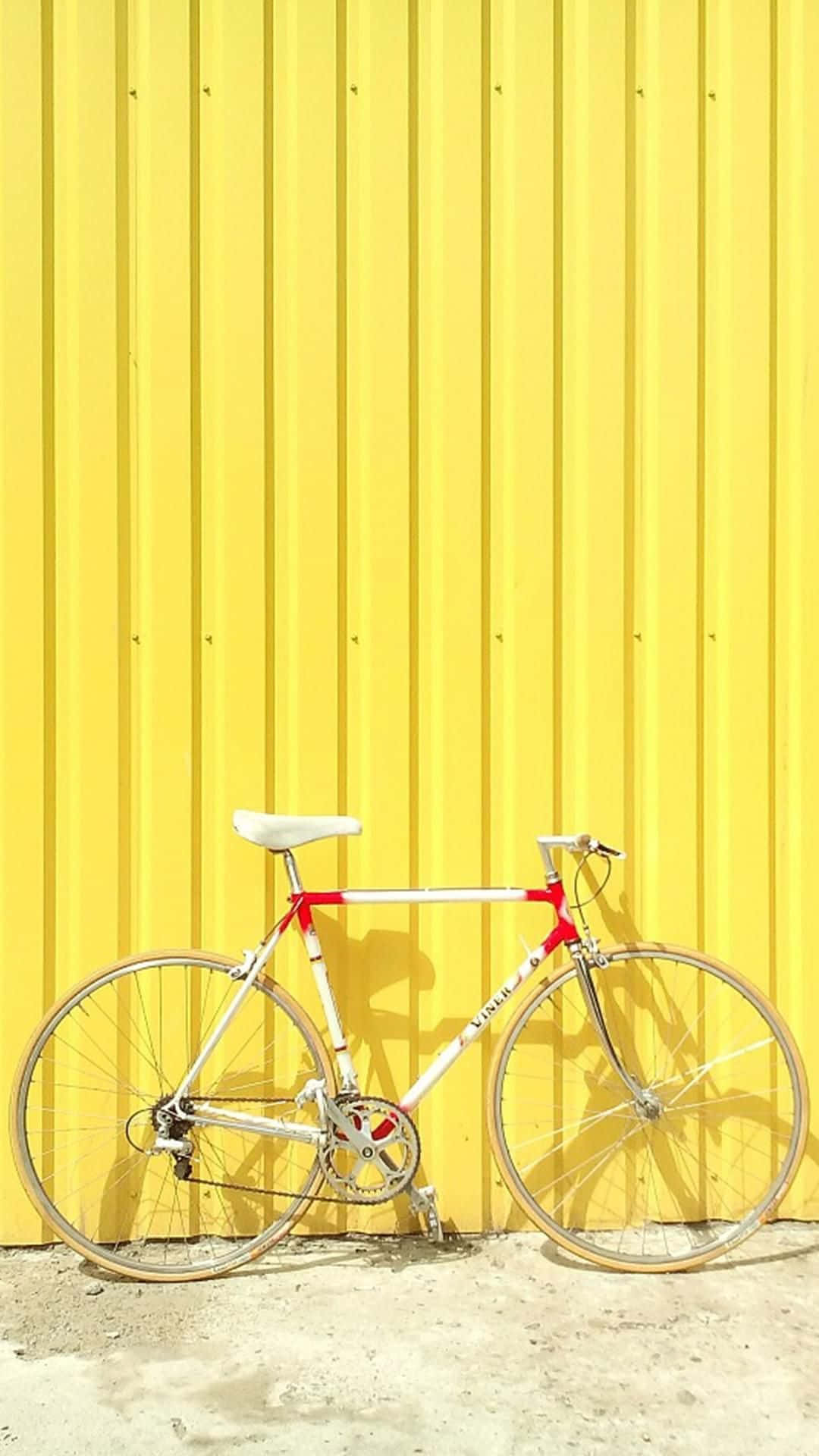 Yellow Wall White Bike Summer Aesthetic.jpg Wallpaper