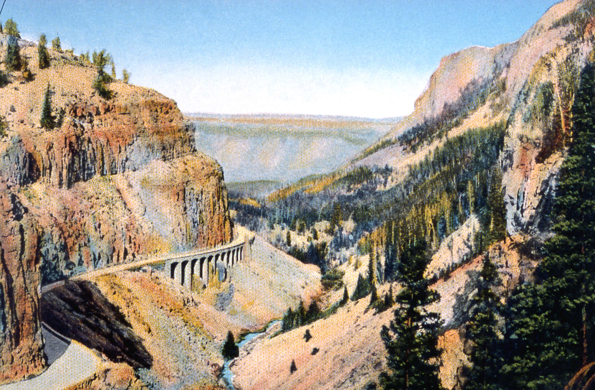 Pinturade Yellowstone Del Camino Junto A La Montaña Como Fondo.