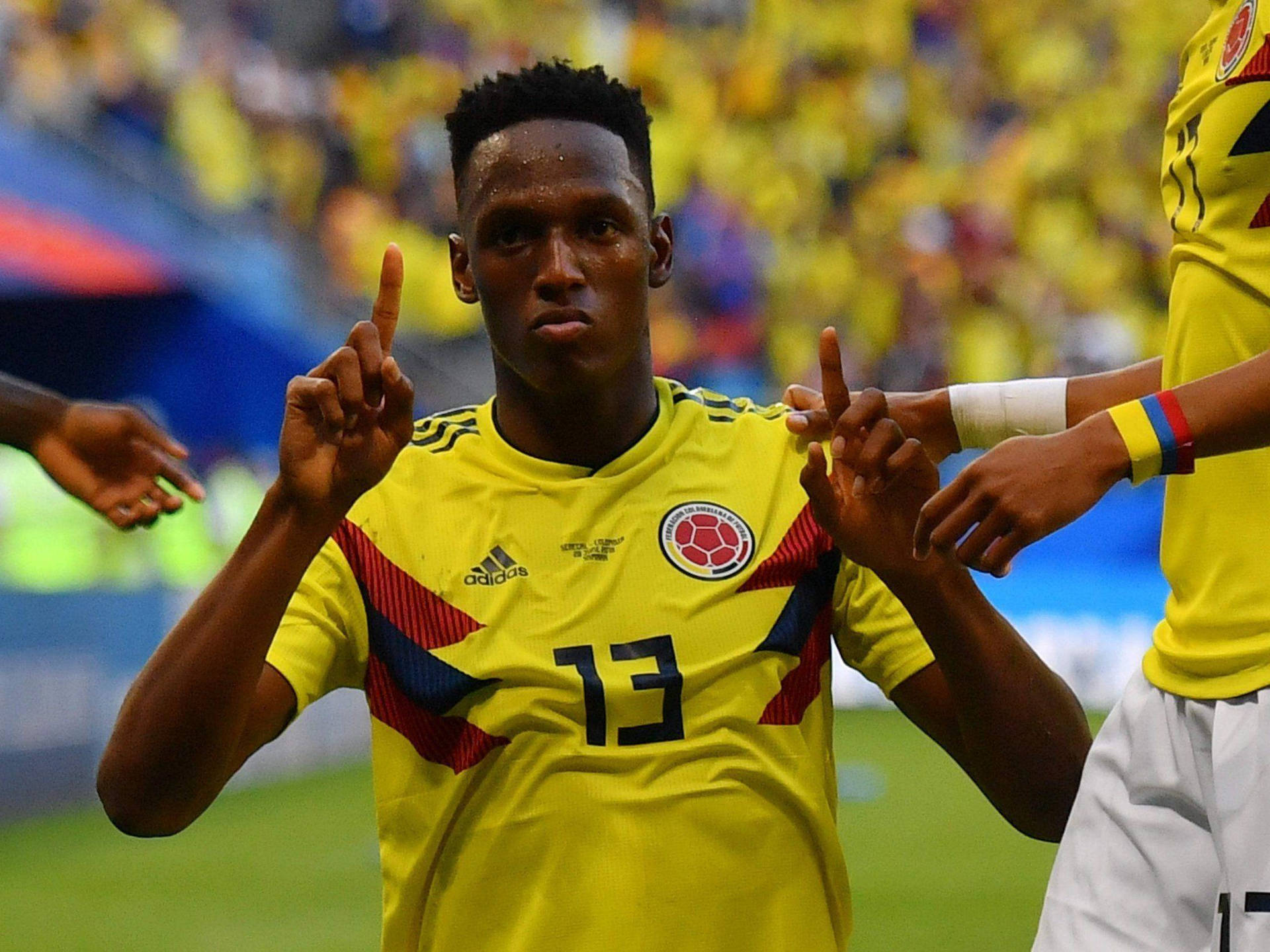 Yerry Mina Holding Pointer Fingers Up Wallpaper