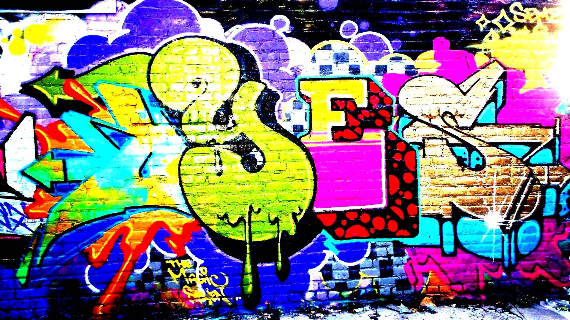 A colorful wallpaper of massive YES word graffiti on brick wall.