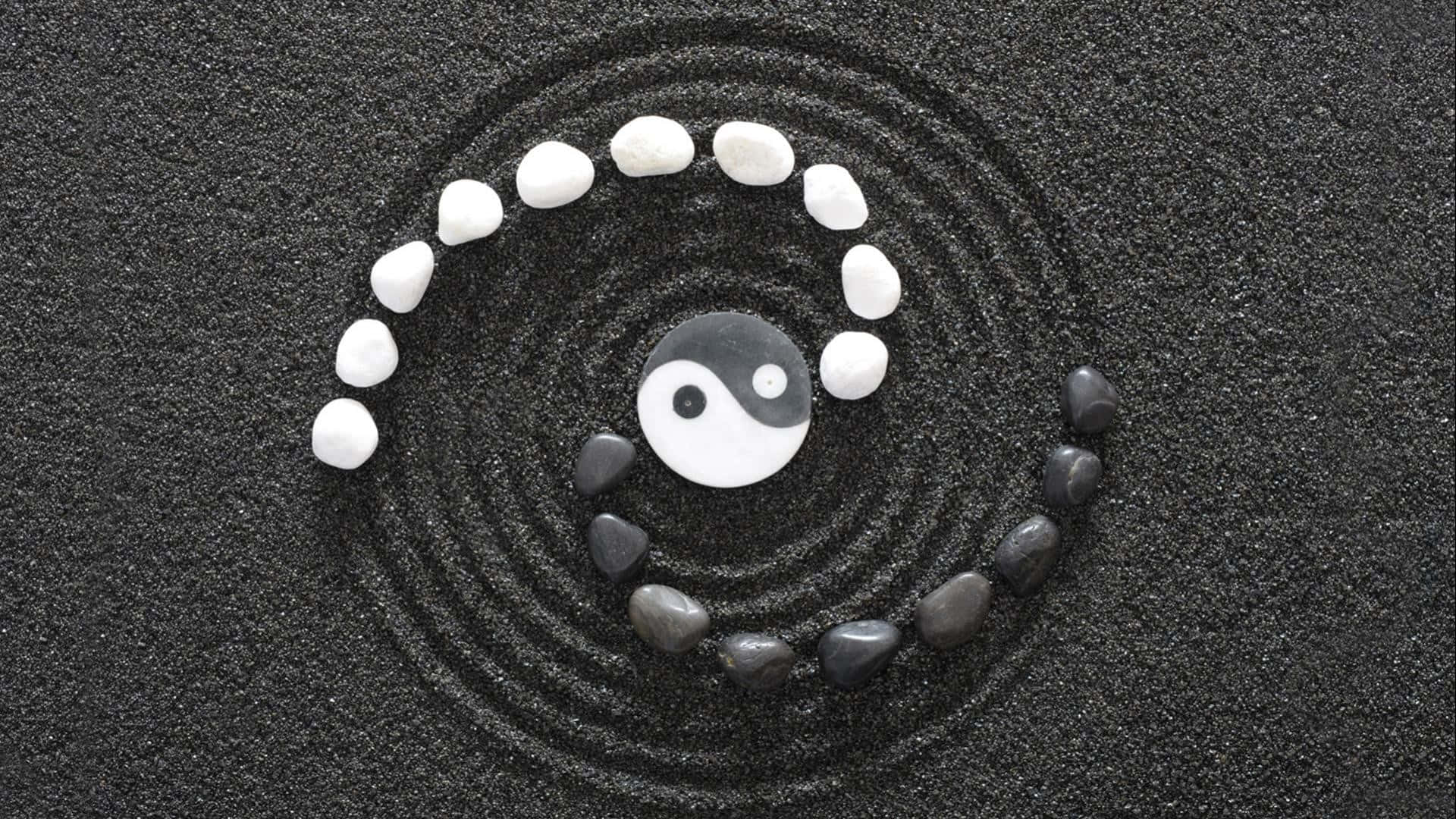A Yin Yang Symbol With Stones And Pebbles