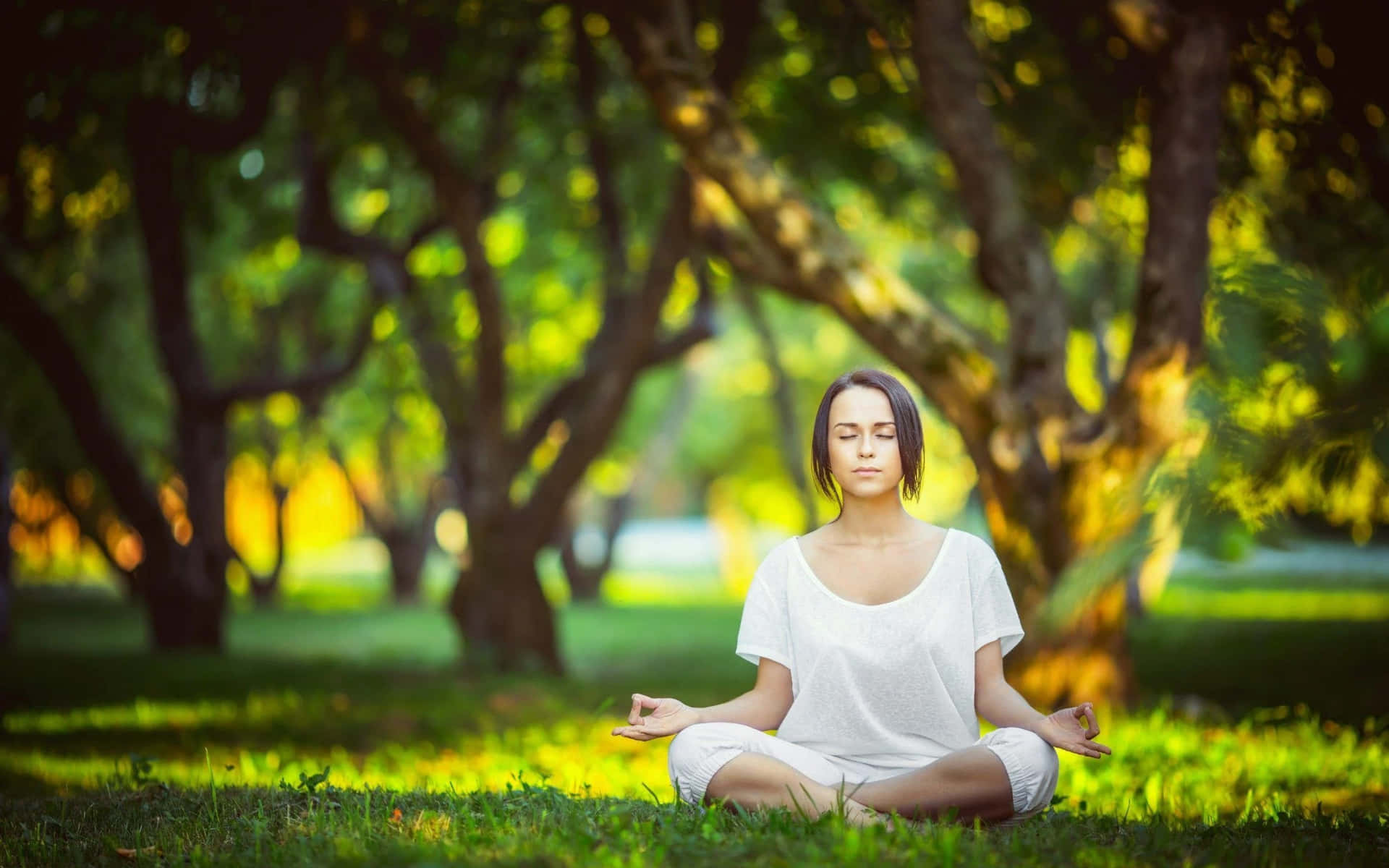Woman Meditating In The Park