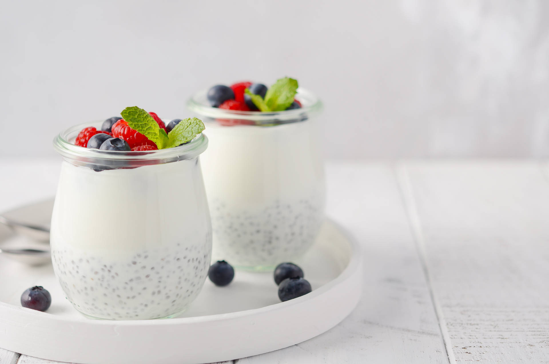 Wholesome Yogurt with Fresh Blueberries and Raspberries Wallpaper