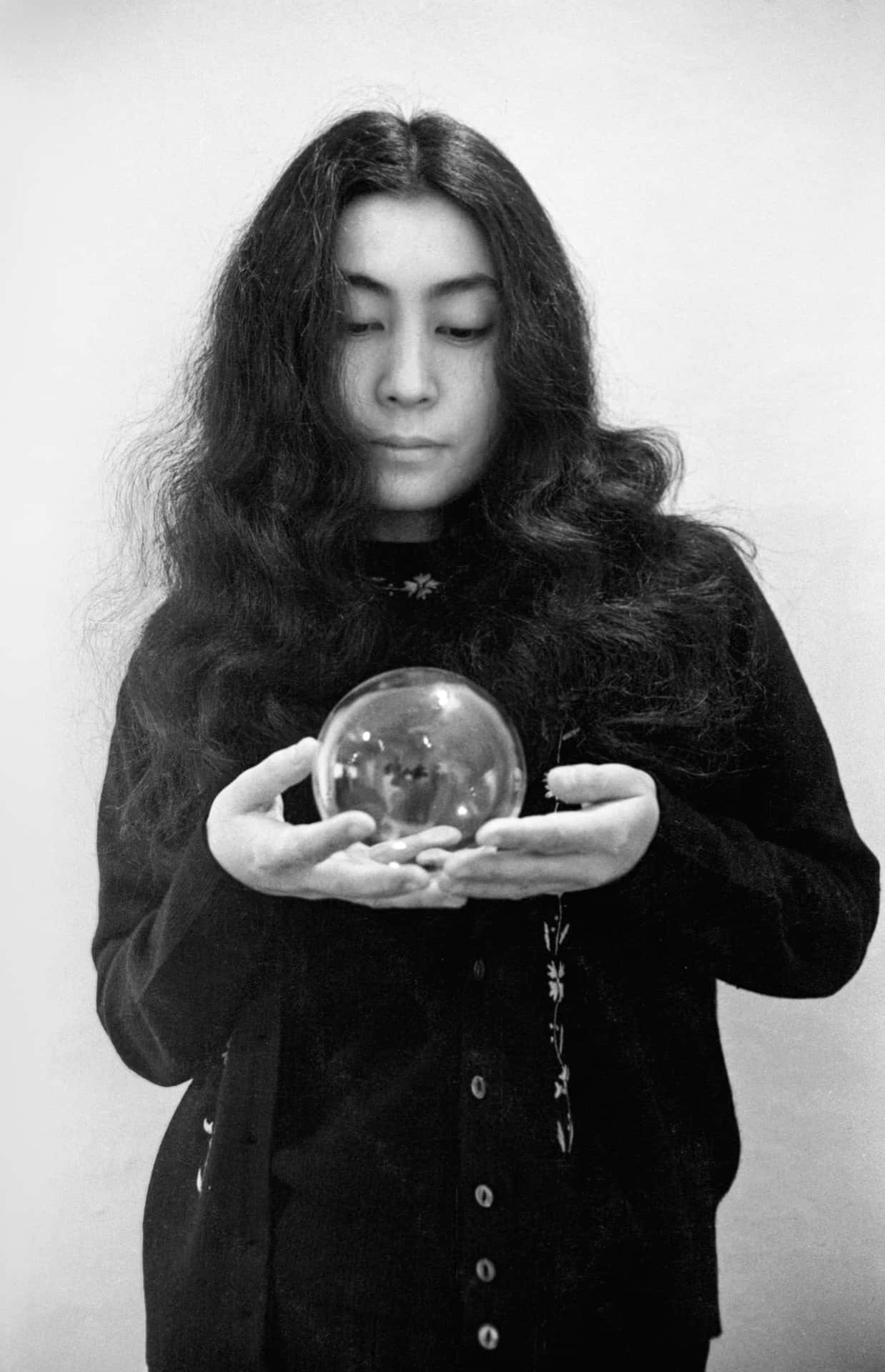 Yoko Ono Holding Sphere Wallpaper