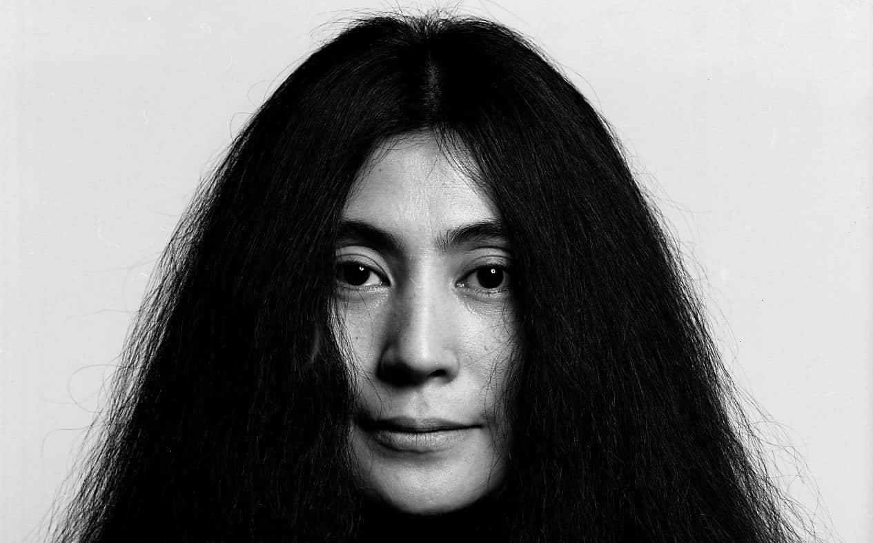 Yoko Ono, Iconic Artist and Activist, with her signature long hair Wallpaper
