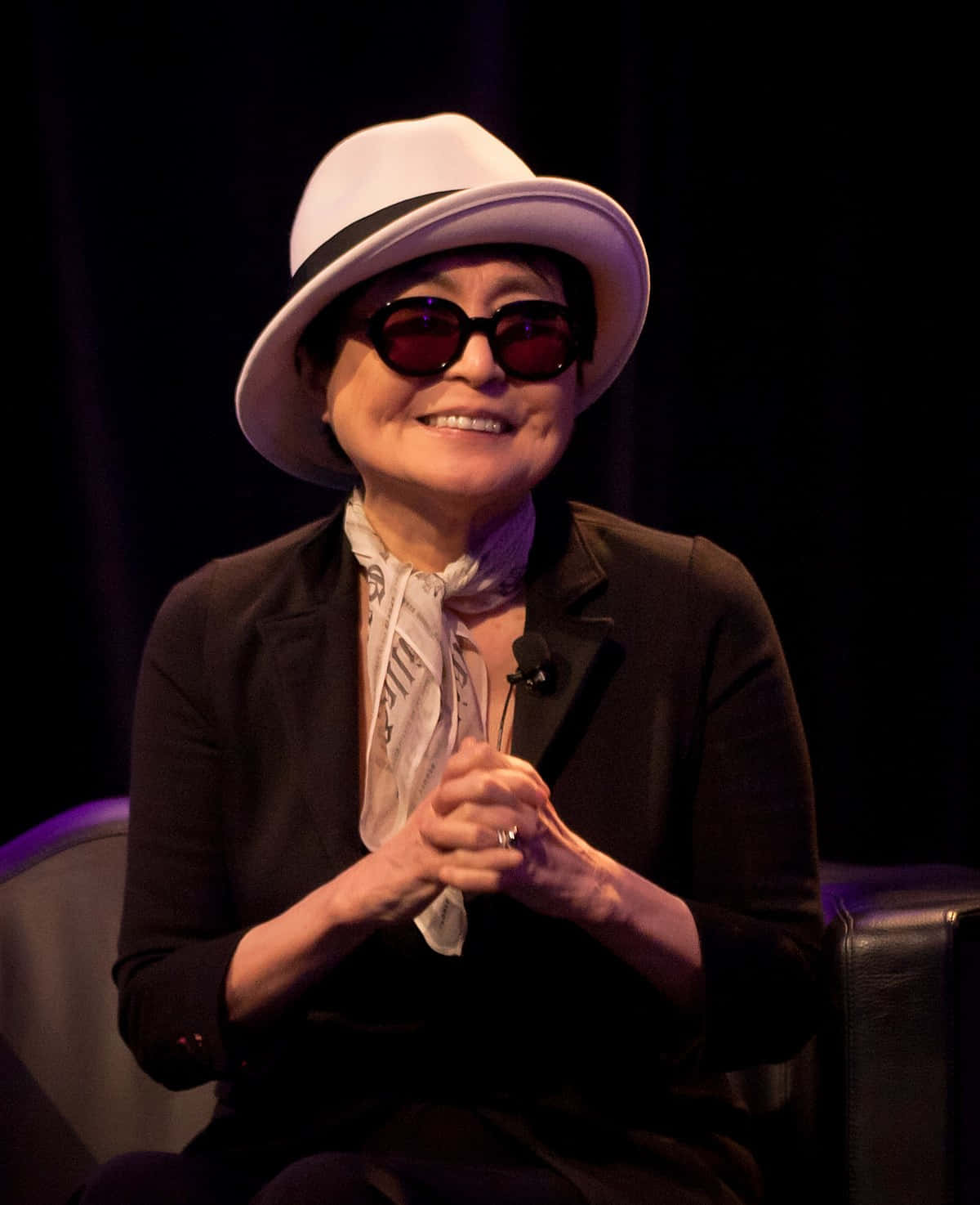 Yoko Ono Smiling Clasping Hands Wallpaper