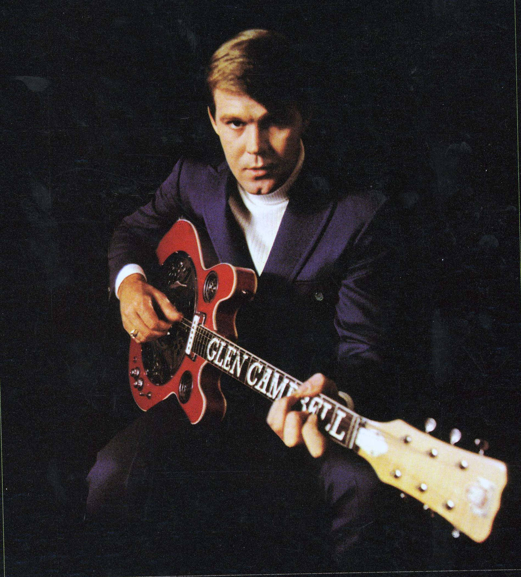 Jovenguitarrista Estadounidense Glen Campbell Con Una Guitarra. Fondo de pantalla