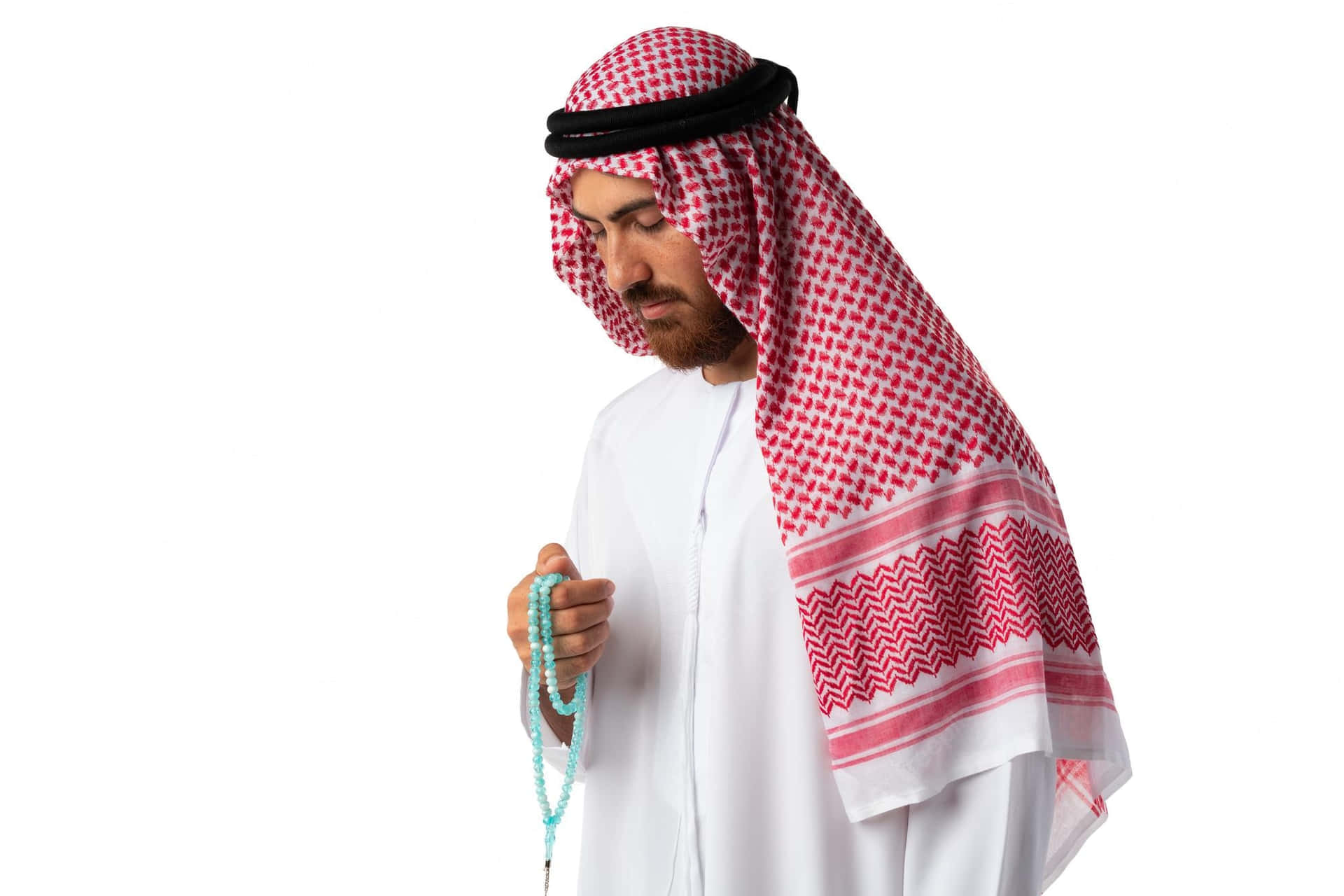 Young Arab Man Praying On White Background Wallpaper