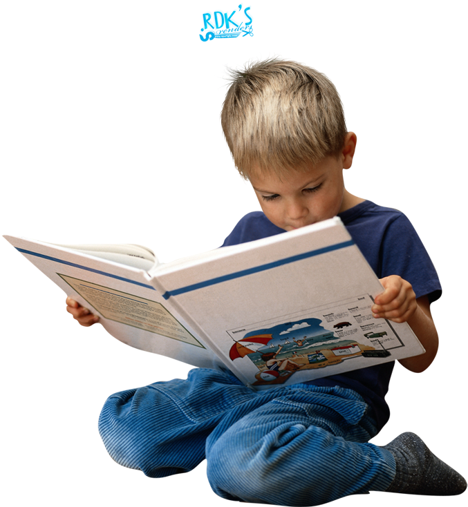 Young Boy Engrossedin Reading PNG