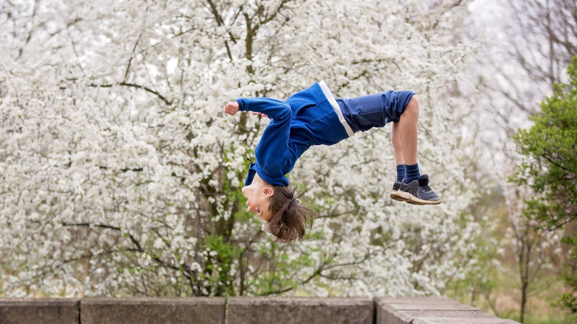 Young Boy Summersault Tumbling Stunt Spring Season Wallpaper