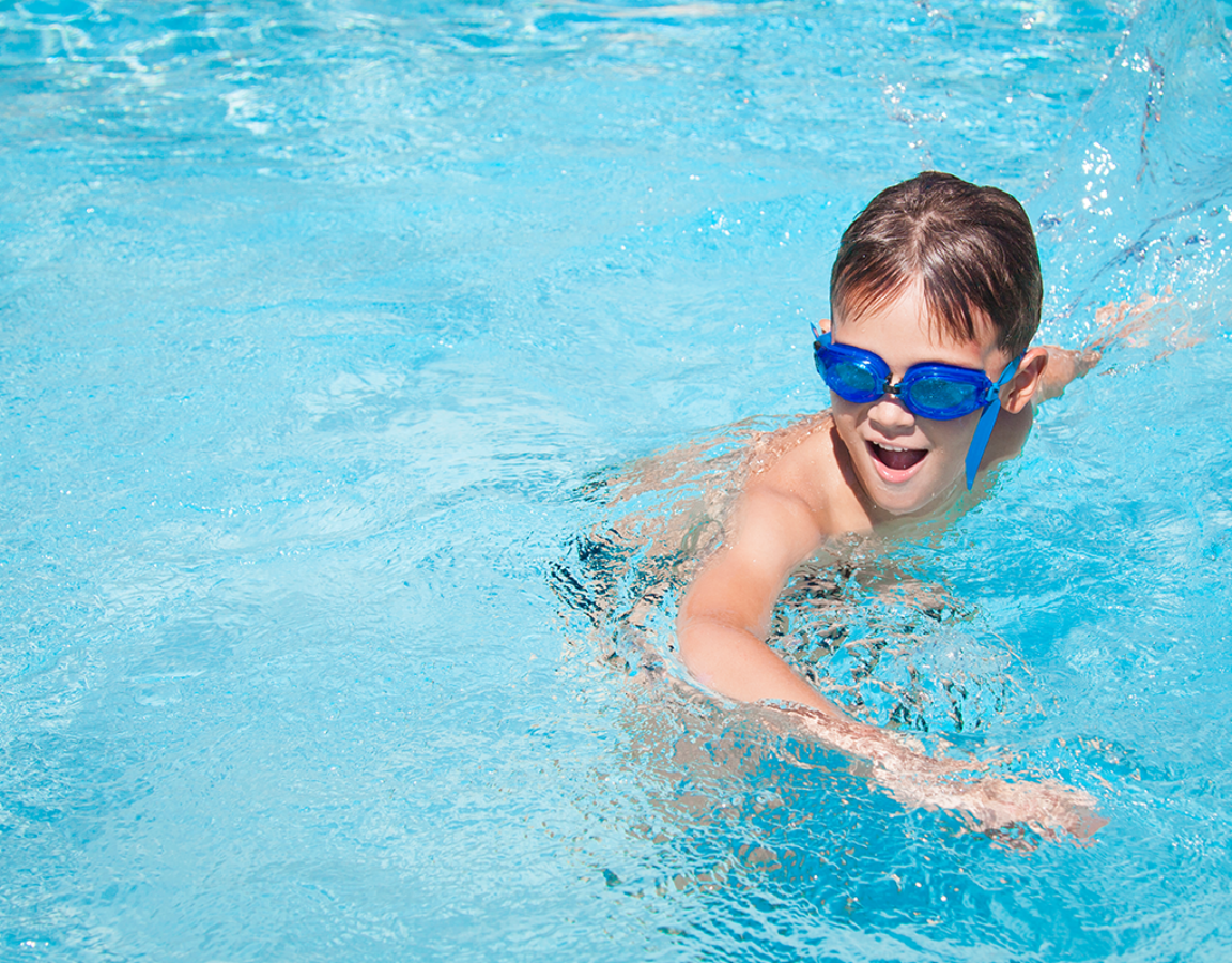 Young Boy Swimming With Goggles