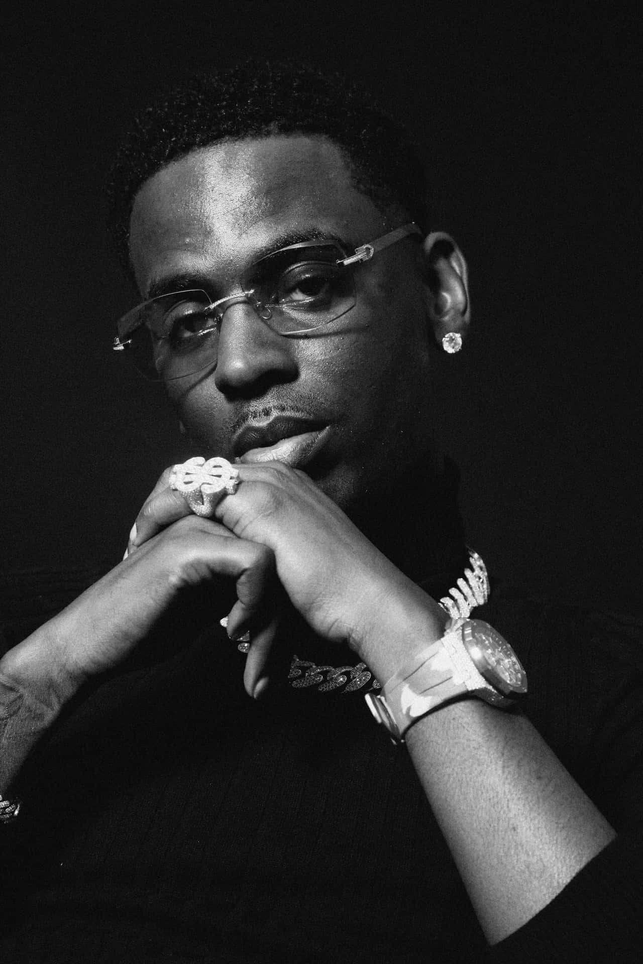 Young Dolph showing off his jewelry Wallpaper