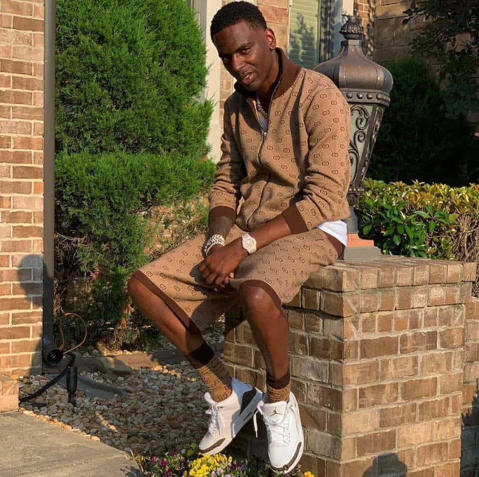 Young Dolph, an American rapper, strikes a pose Wallpaper