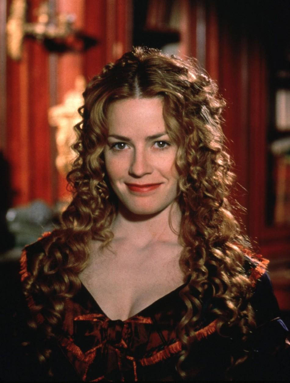 Young Elisabeth Shue With Long Curly Hair Smiling Wallpaper