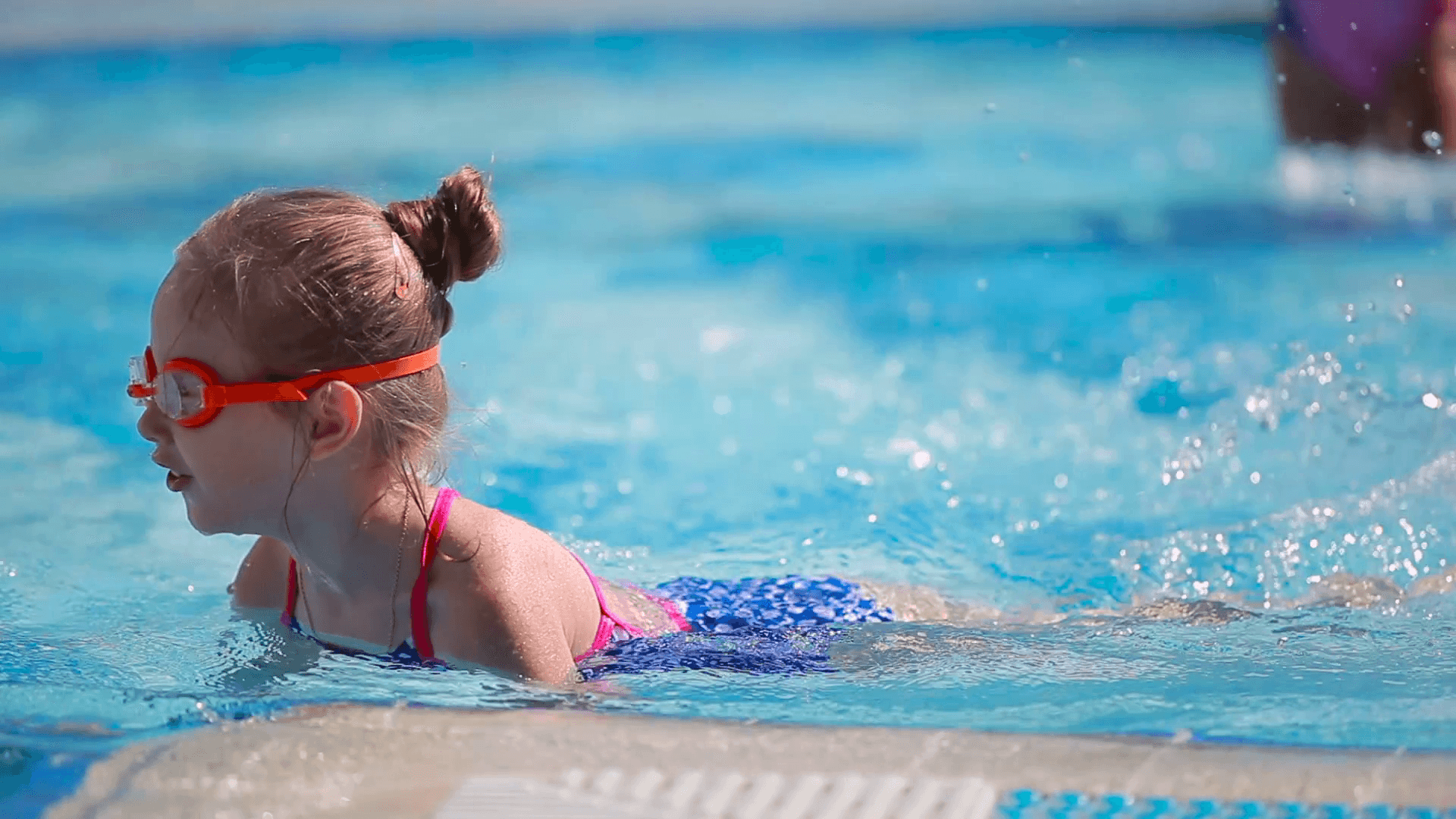 Young Girl Swimming With Goggles