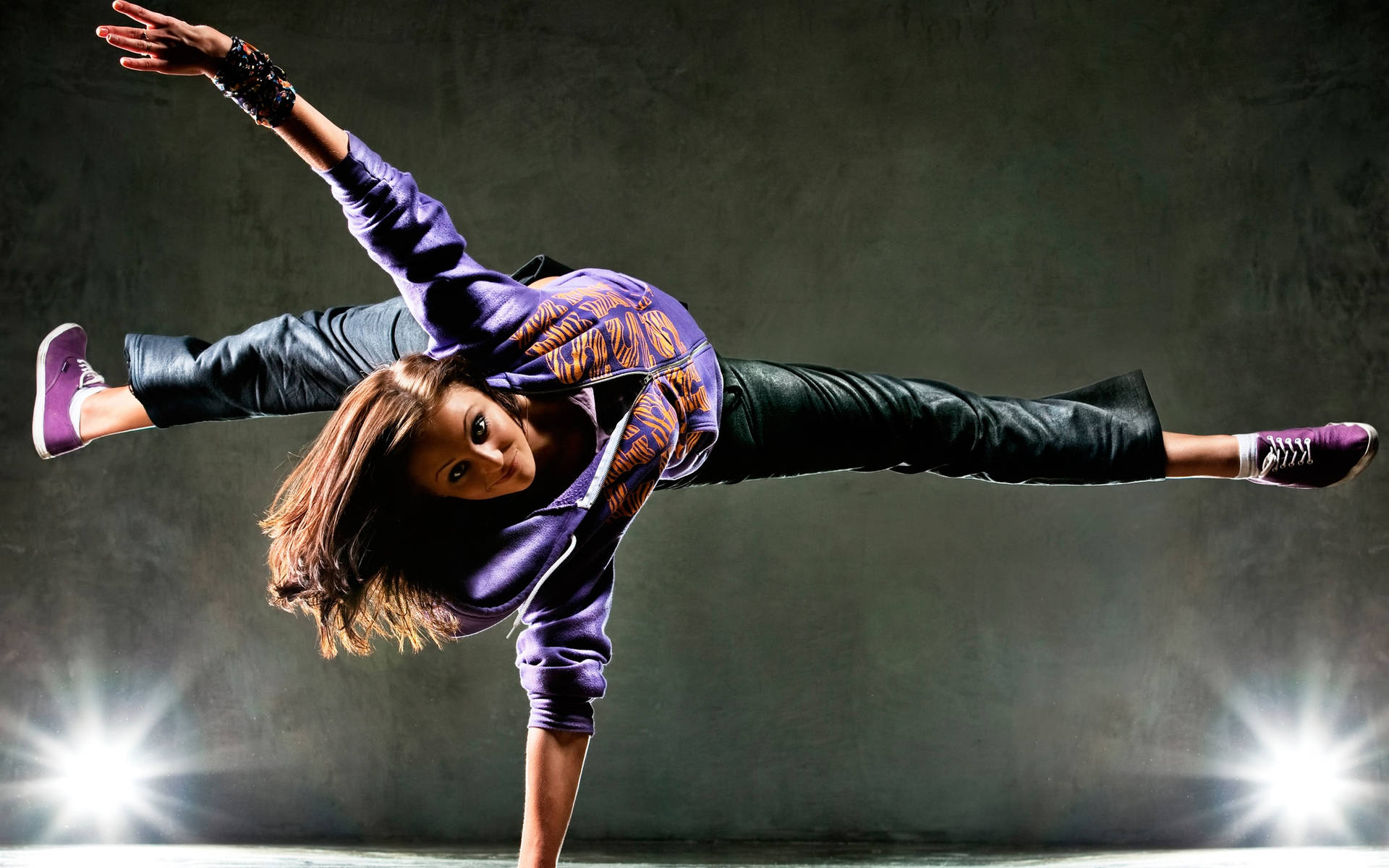 Young Lady Upside Down Dance Pose Wallpaper