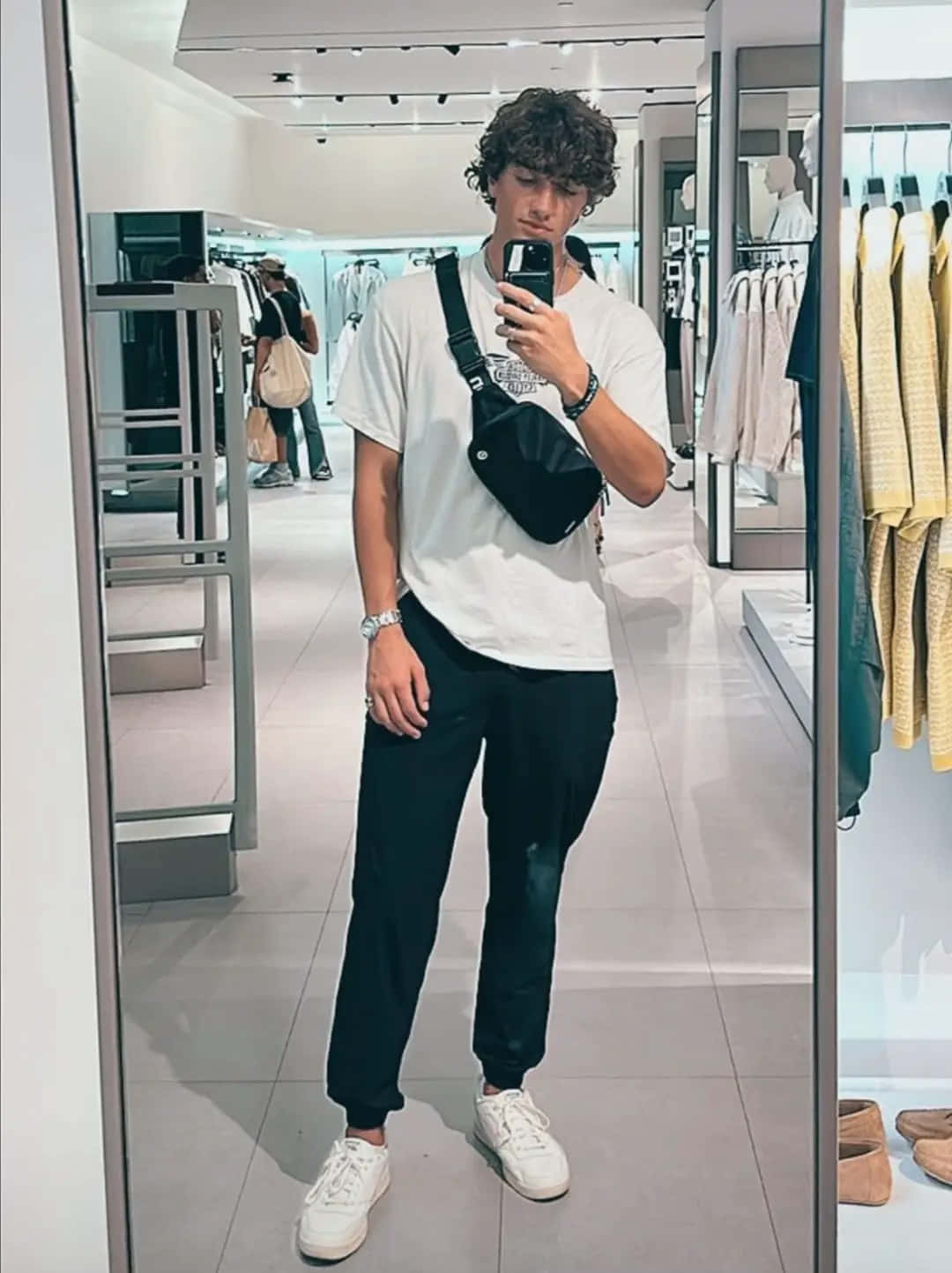 Young Man Mirror Selfie Fashion Store Wallpaper
