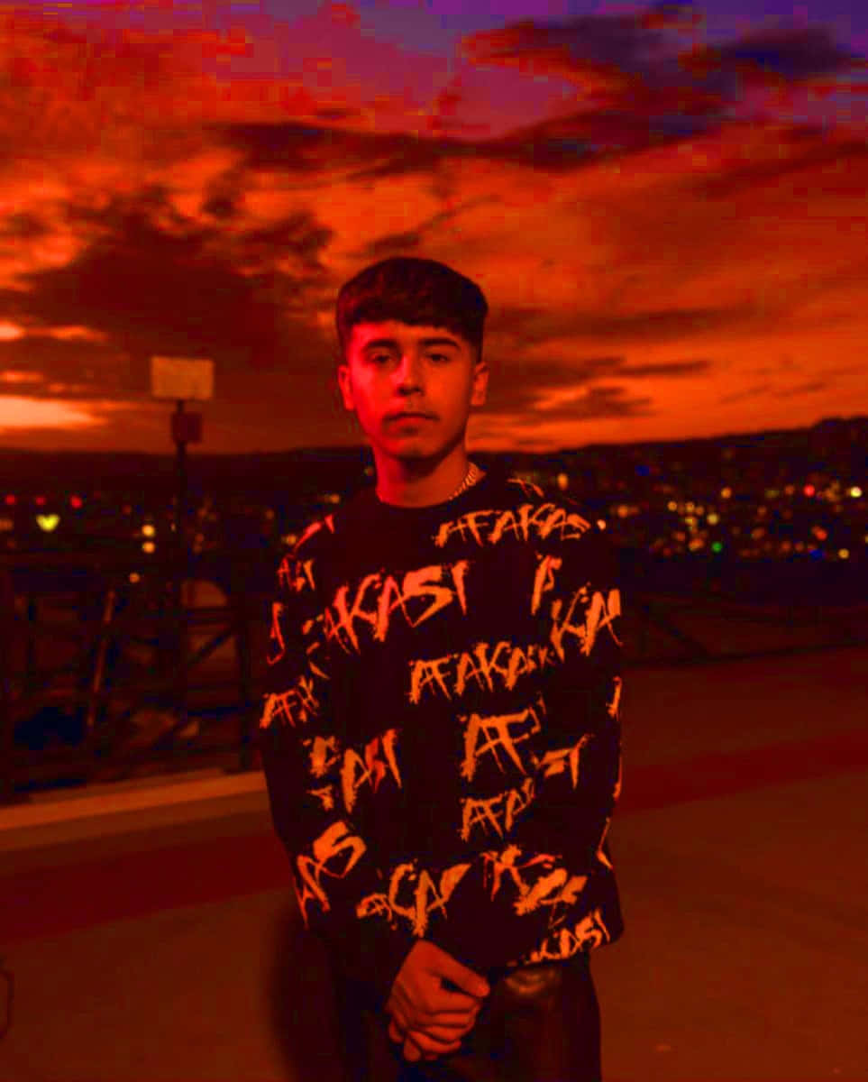 Young Man Red Sunset Backdrop Wallpaper