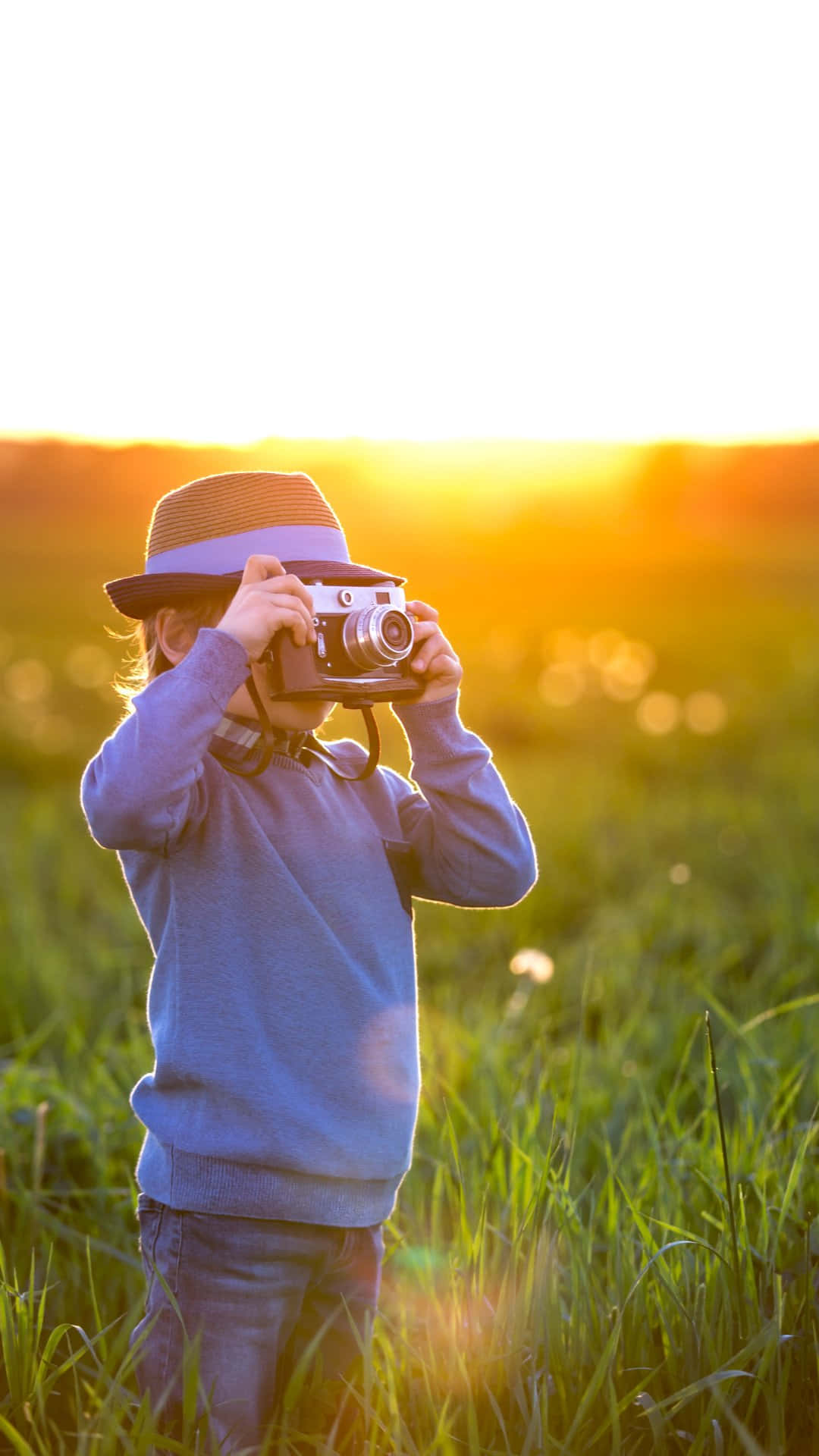 Young Photographerat Sunset Wallpaper