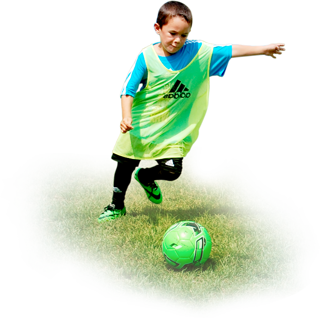 Young Player Kicking Soccer Ball PNG
