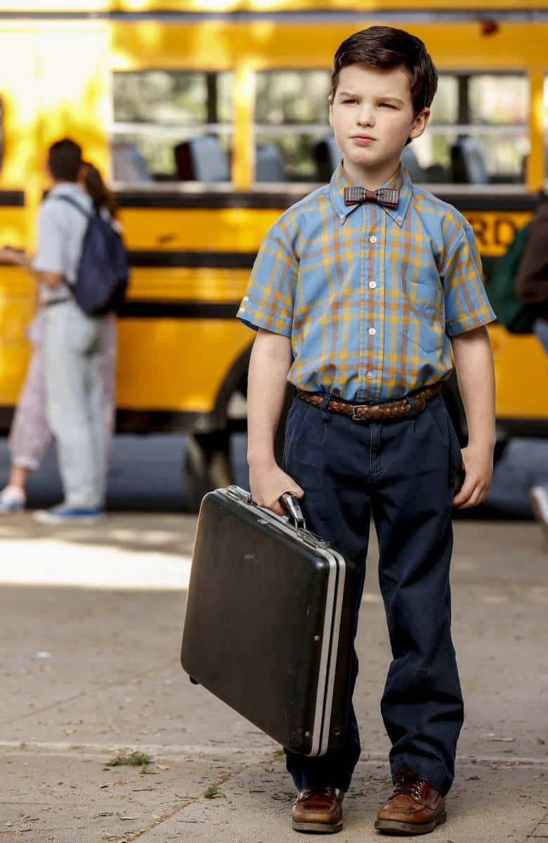 Young Sheldon With Briefcase Wallpaper