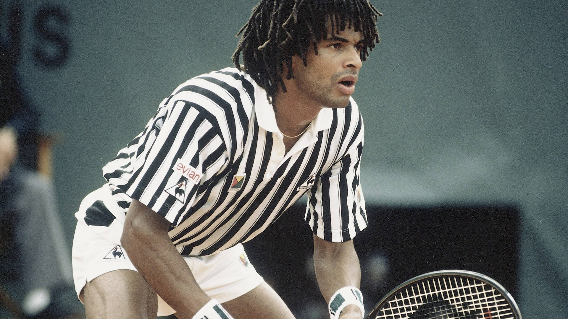 Caption: Young Yannick Noah in action during a tennis match Wallpaper