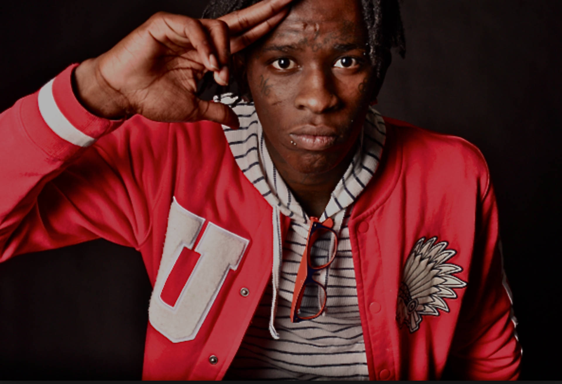 Young Thug in a red sleeve tartan top. Wallpaper