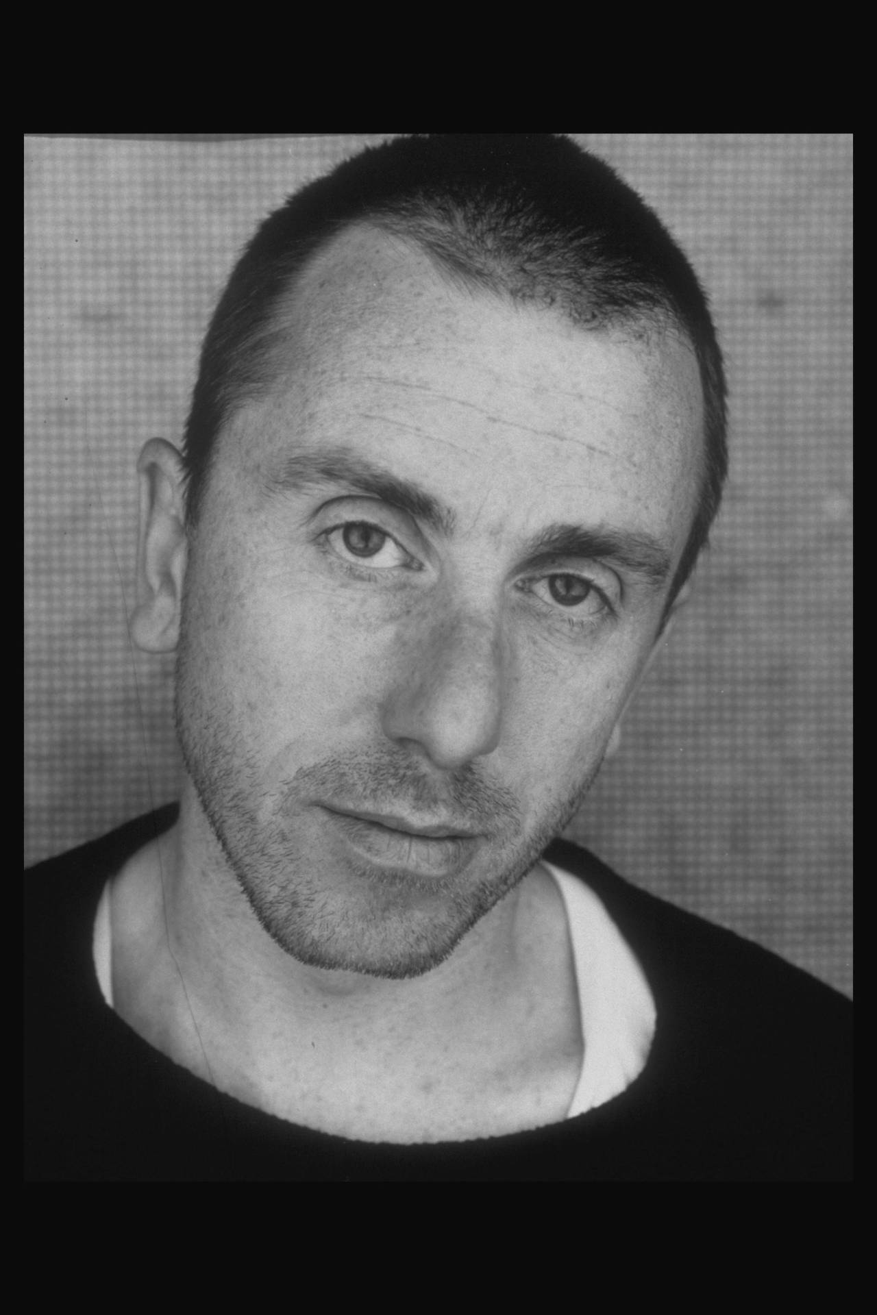 Tim Roth sporting a buzz cut during his early acting career Wallpaper