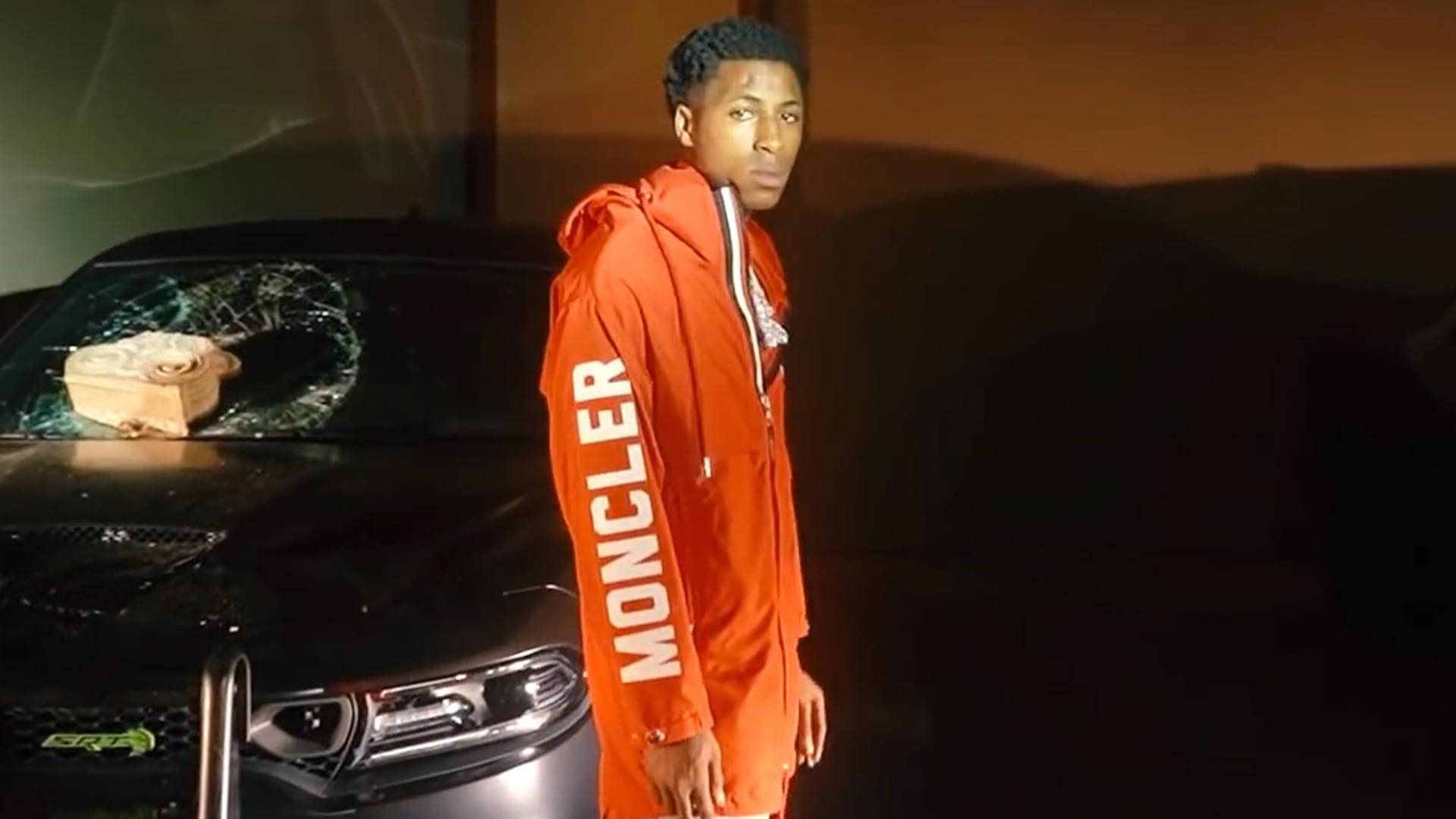 Youngboy Never Broke Again strikes a pose for the camera. Wallpaper