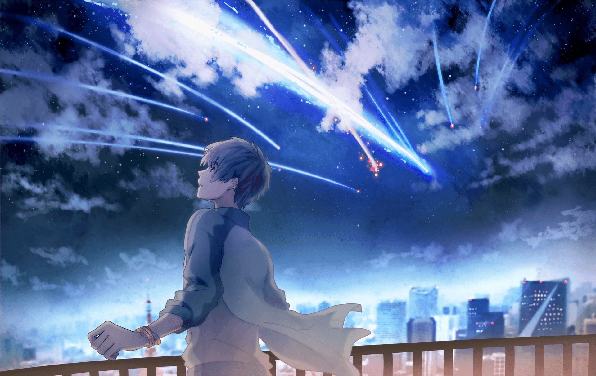 A Boy Is Standing On A Balcony Looking At The Sky