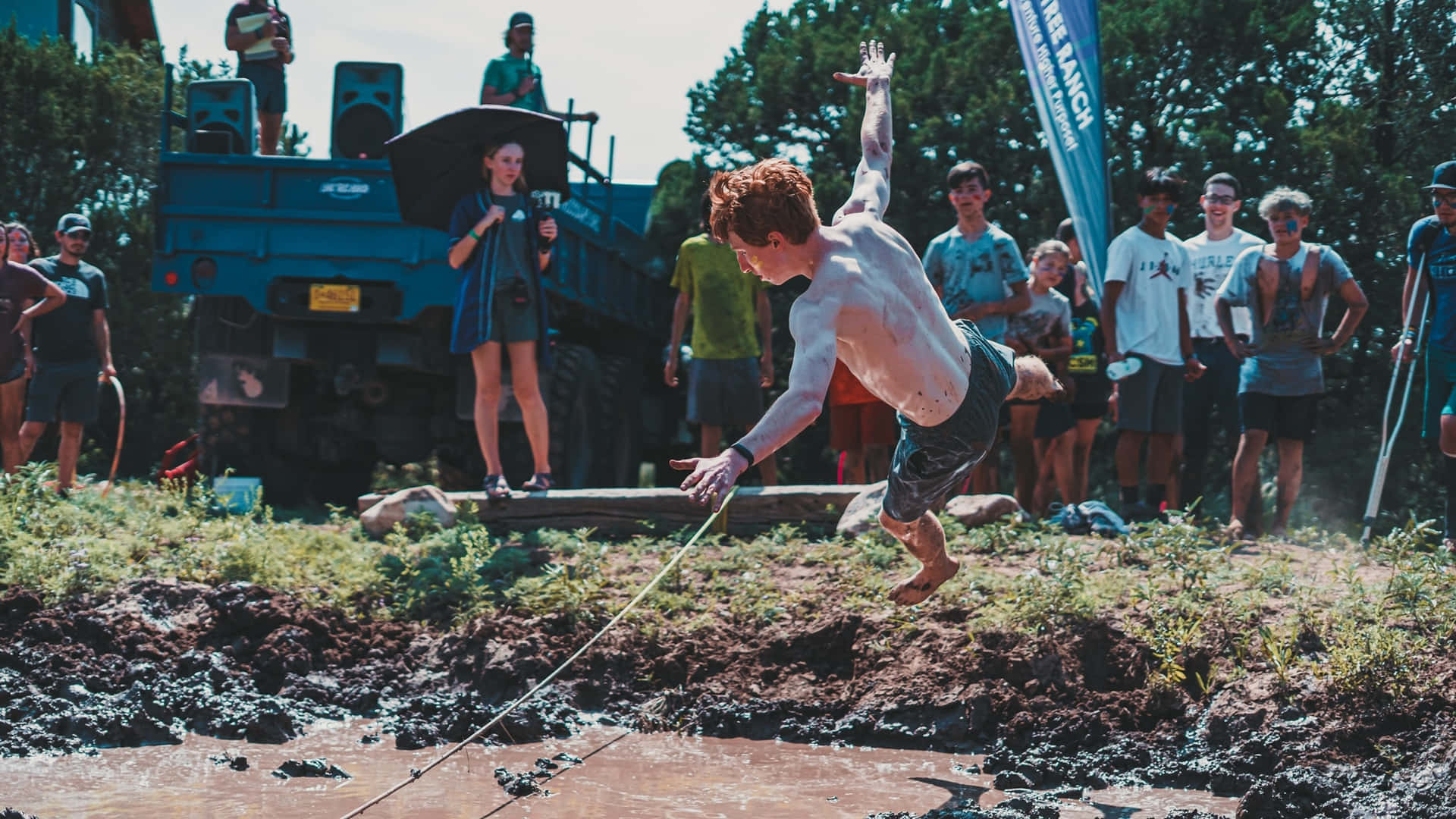 Download Youth Mud Obstacle Course Jump Wallpaper 