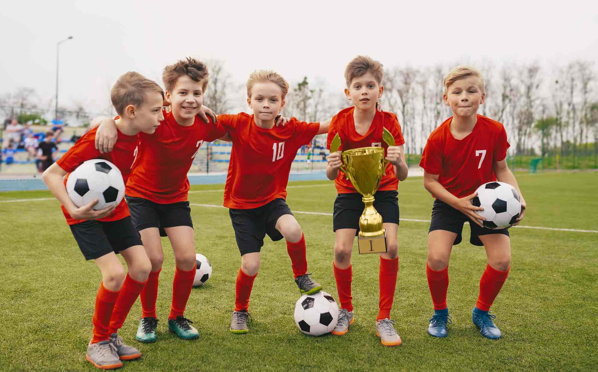 Youth Soccer Team Celebrationwith Trophy.jpg Wallpaper
