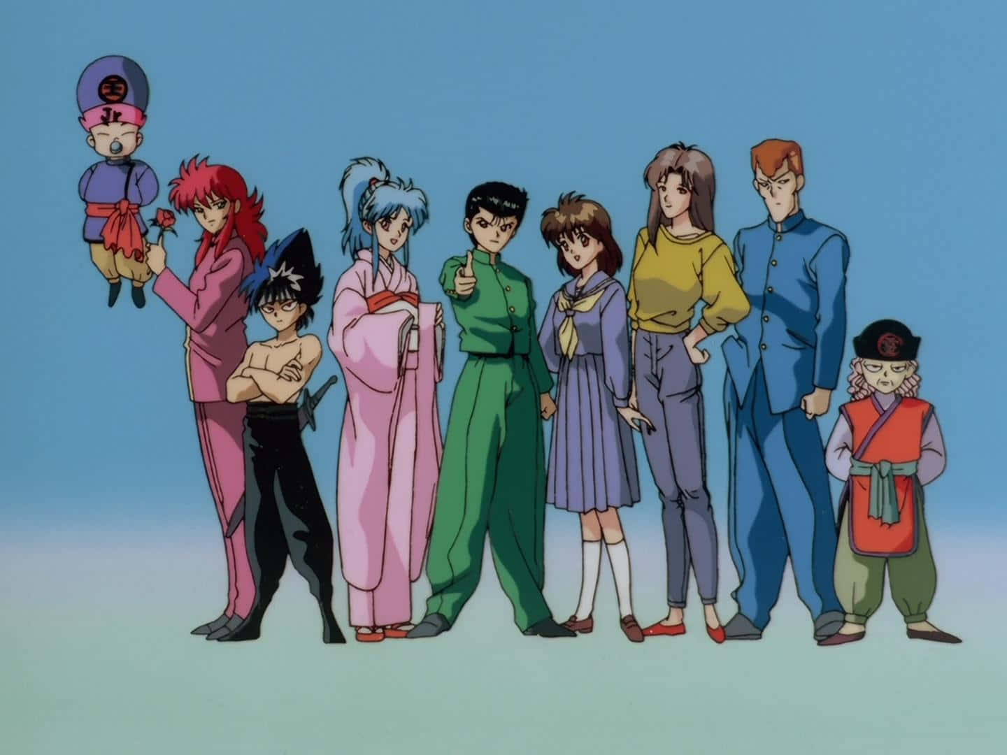 En gruppe animekarakterer, der står sammen på stranden