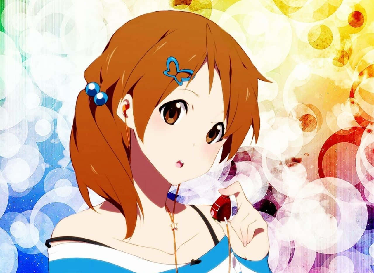 Yui Hirasawa playing her guitar with a bright smile Wallpaper