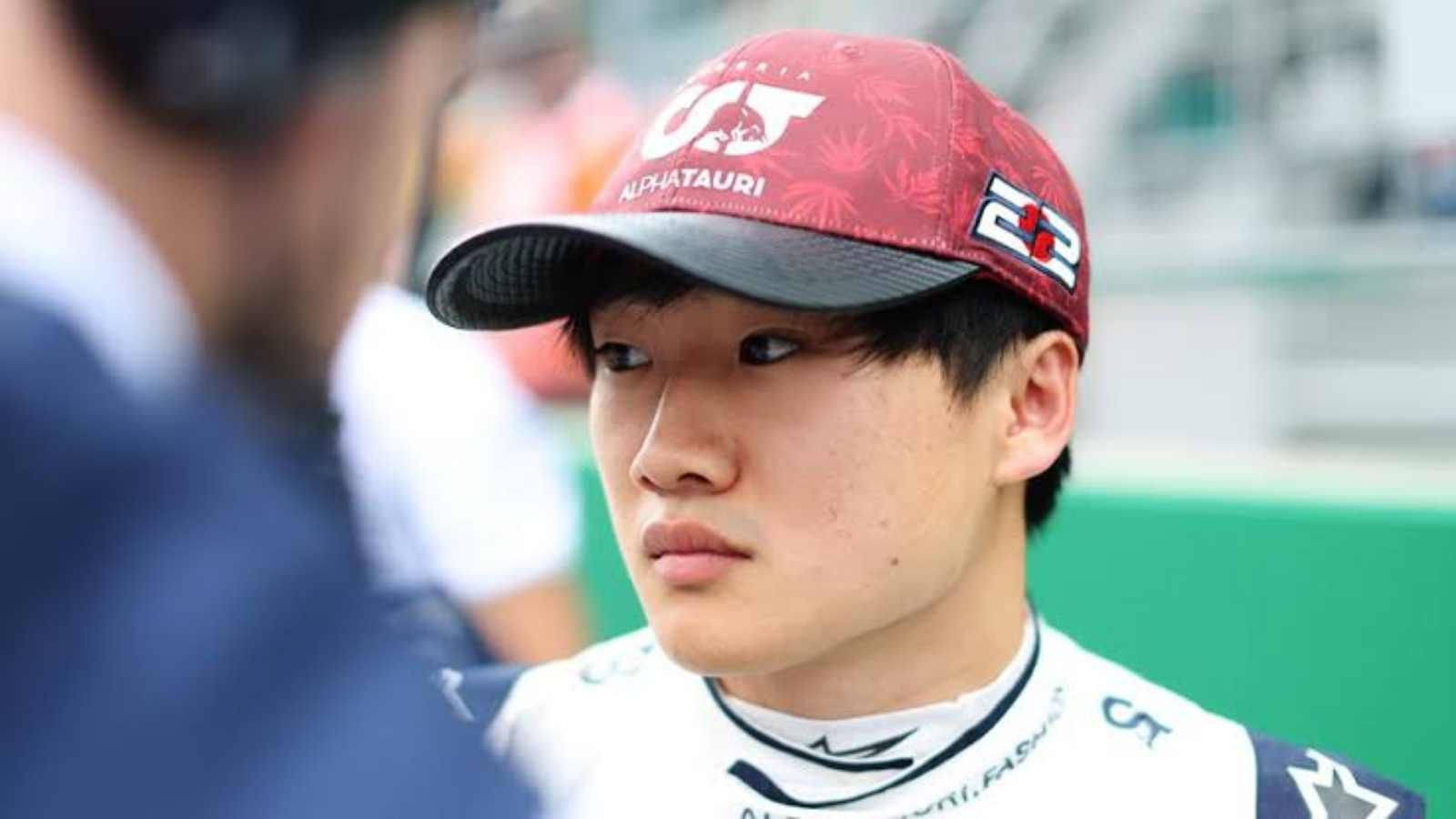 Rising F1 Star, Yuki Tsunoda, in His Signature Red Cap Wallpaper