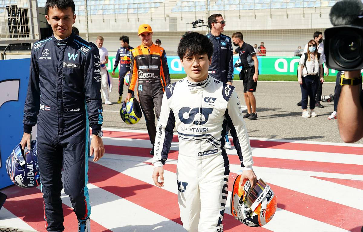 Yuki Tsunoda interacting with a Williams driver Wallpaper