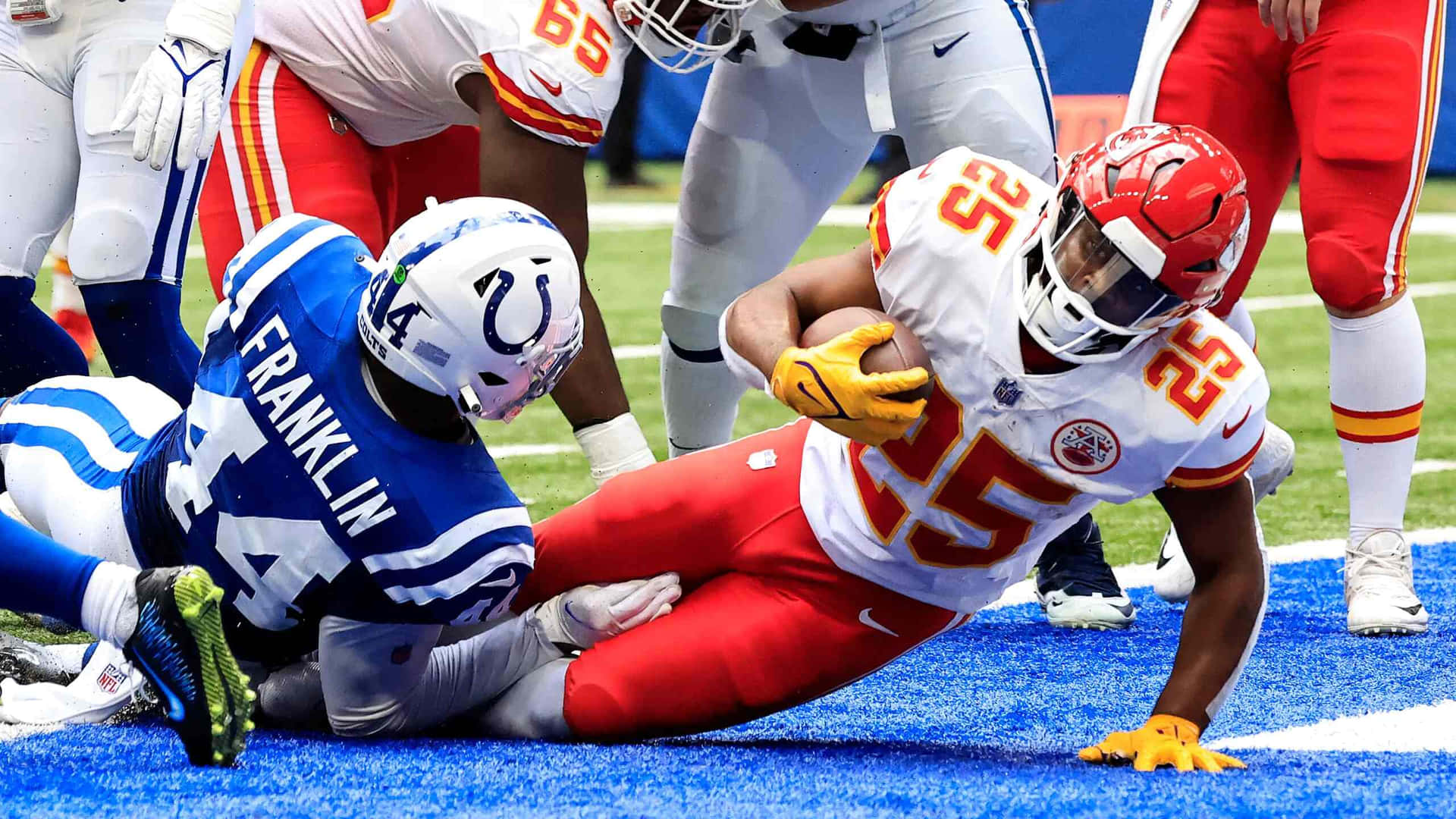 Zaire Franklin Tackling Opponent During Game Wallpaper