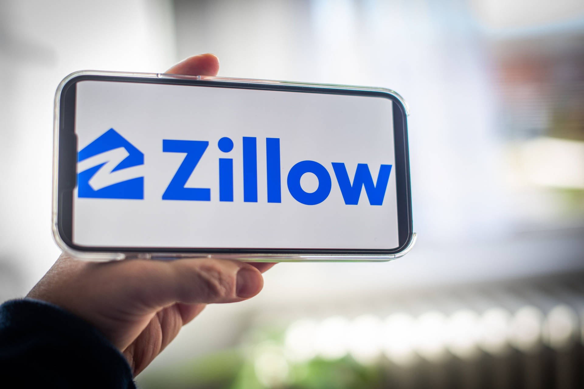 Logotipode Zillow En El Teléfono. Fondo de pantalla