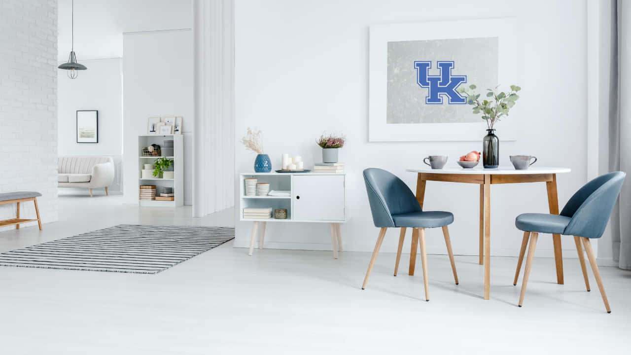A White Living Room With Blue Chairs And A White Table