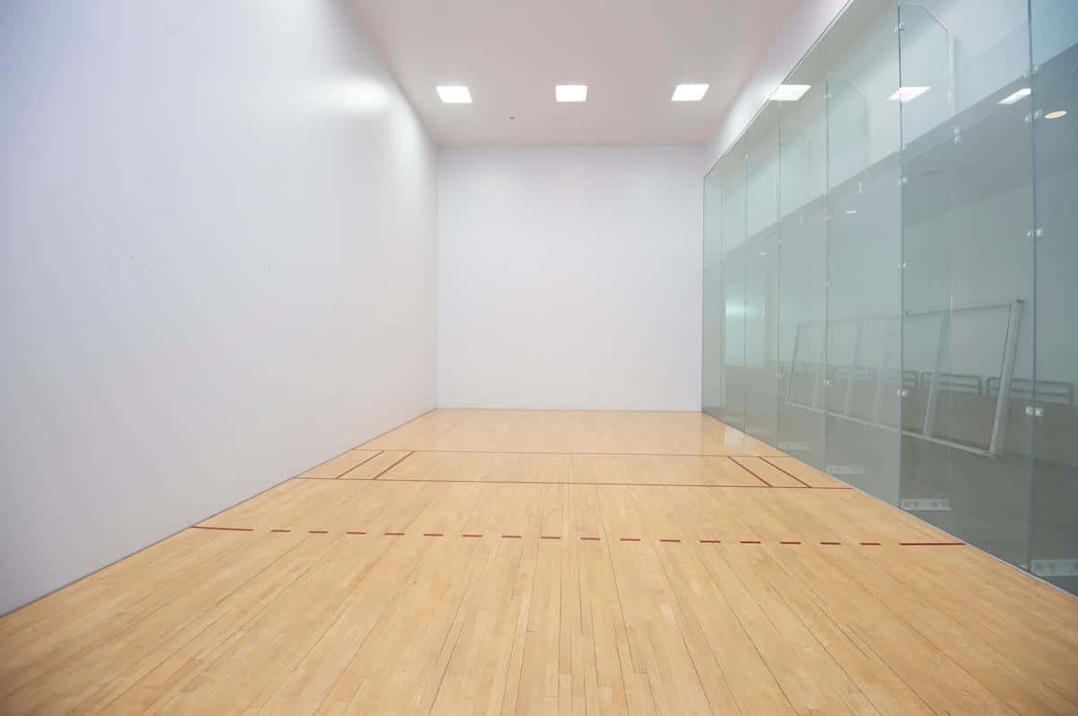 A Squash Court With A Wooden Floor
