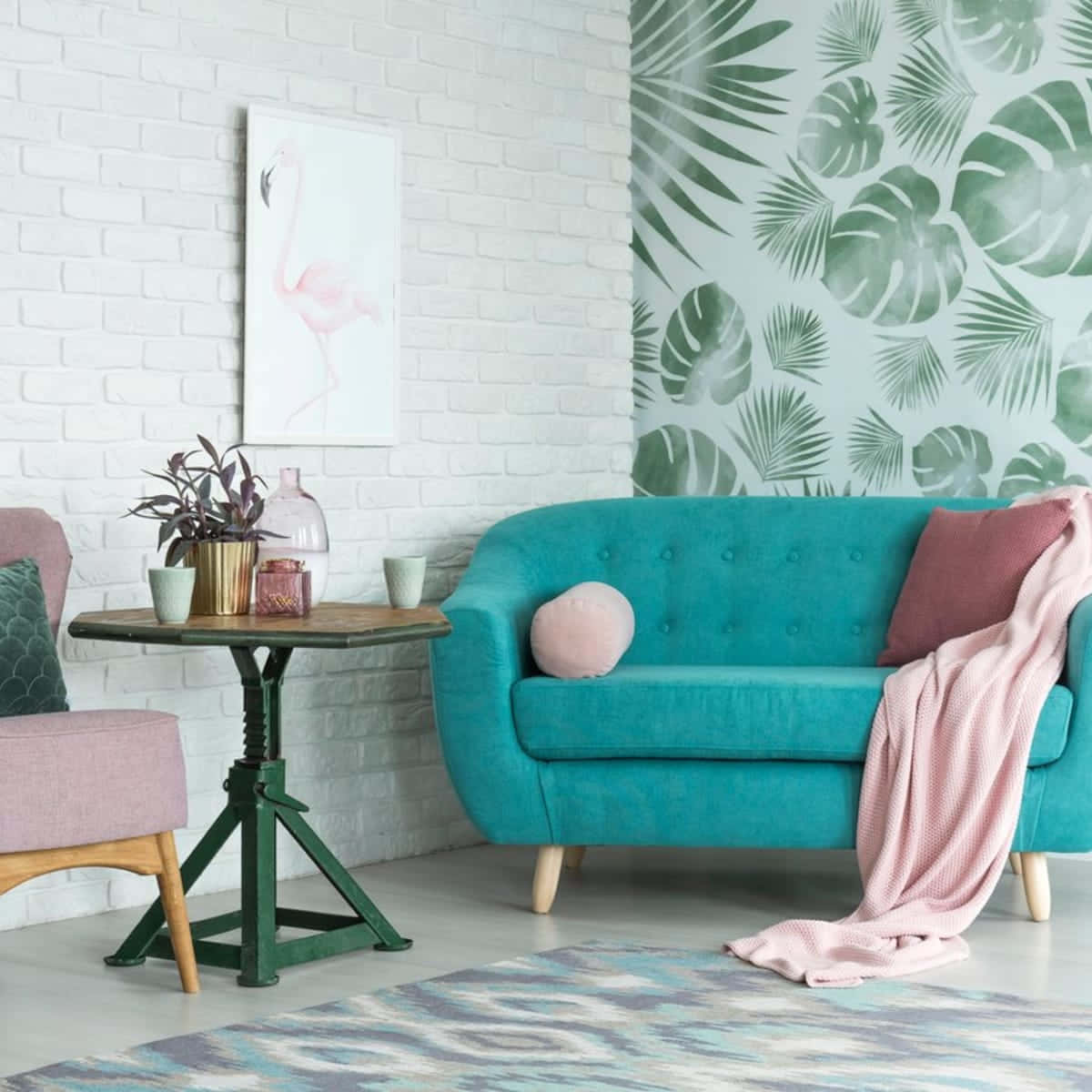 A Living Room With A Blue Sofa And Pink Chair