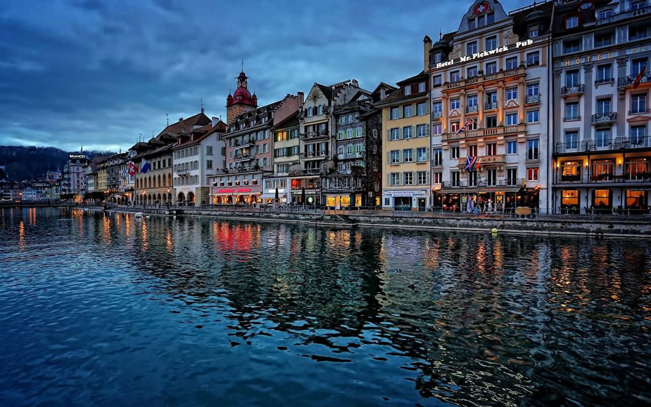 Zurich Riverfront Evening Lights Wallpaper