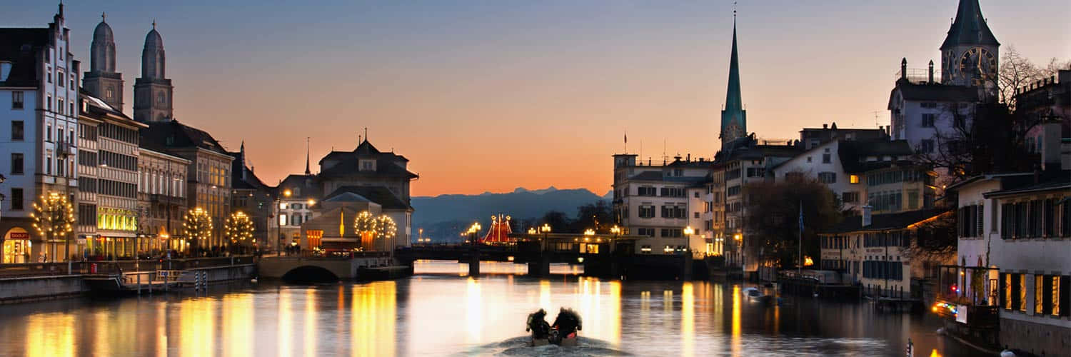 Zurich Riverfront Twilight Panorama Wallpaper
