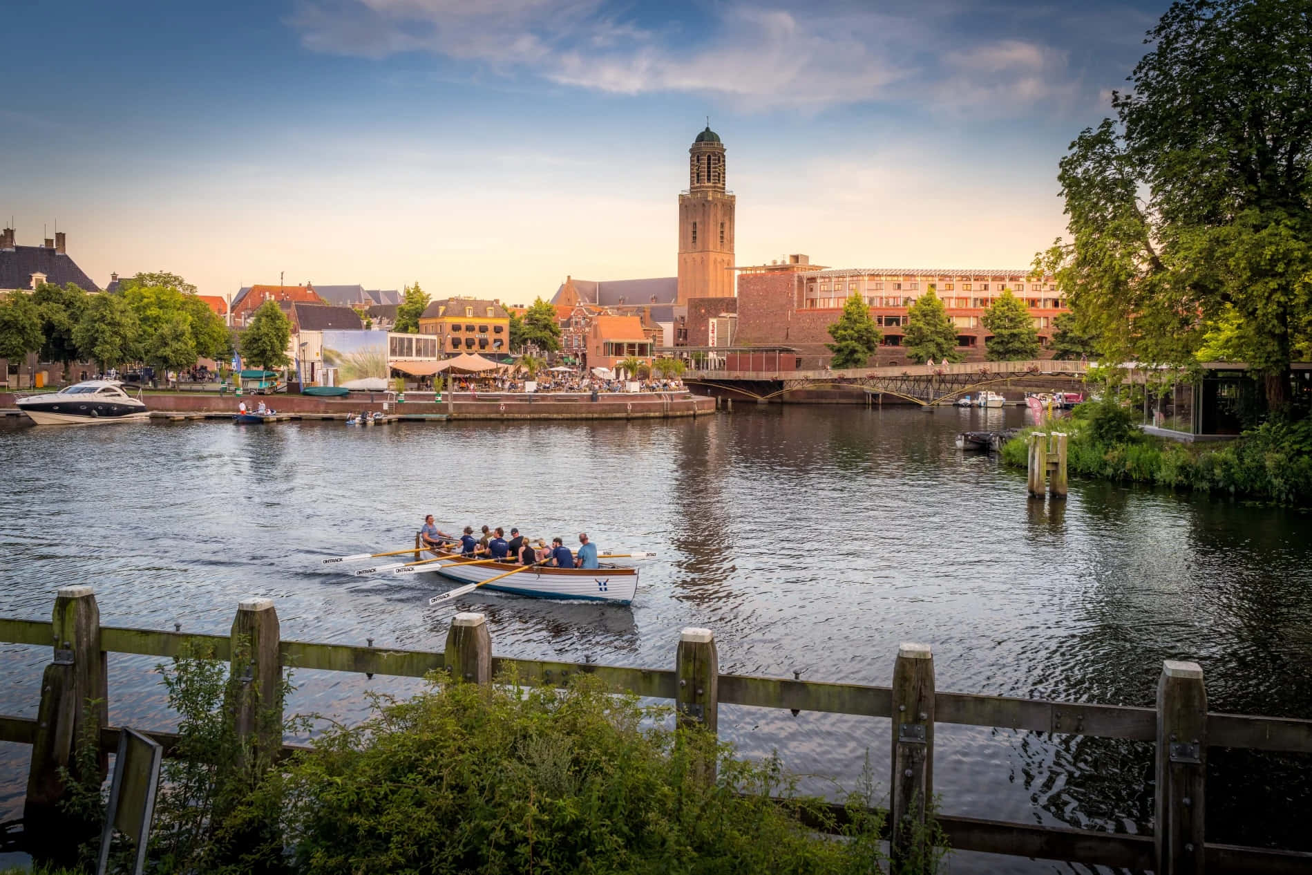 Zwolle Cityscapewith Rowing Teamon River Wallpaper